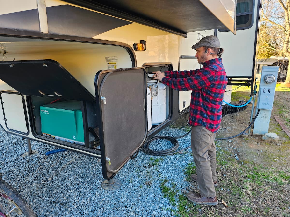 JC Barringer checks the propane tank levels of his KZ Durango fifth wheel.