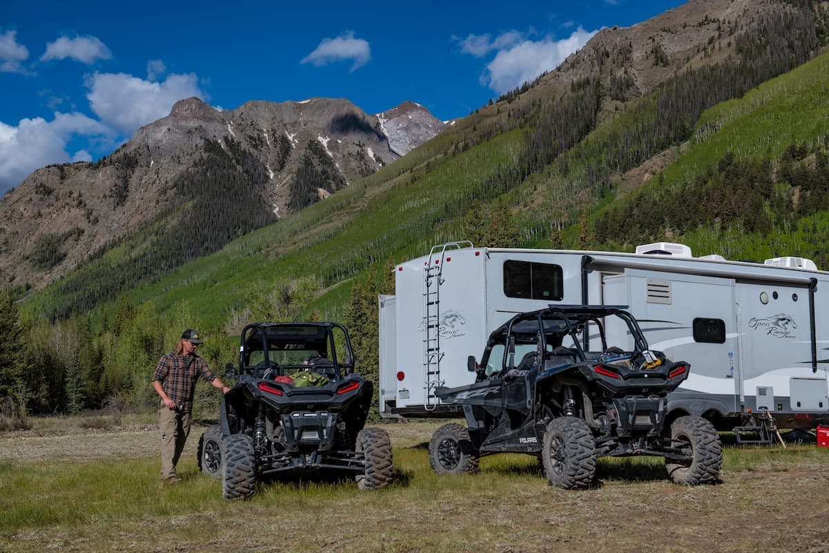Shannon Carew's husband next to two side-by-sides.