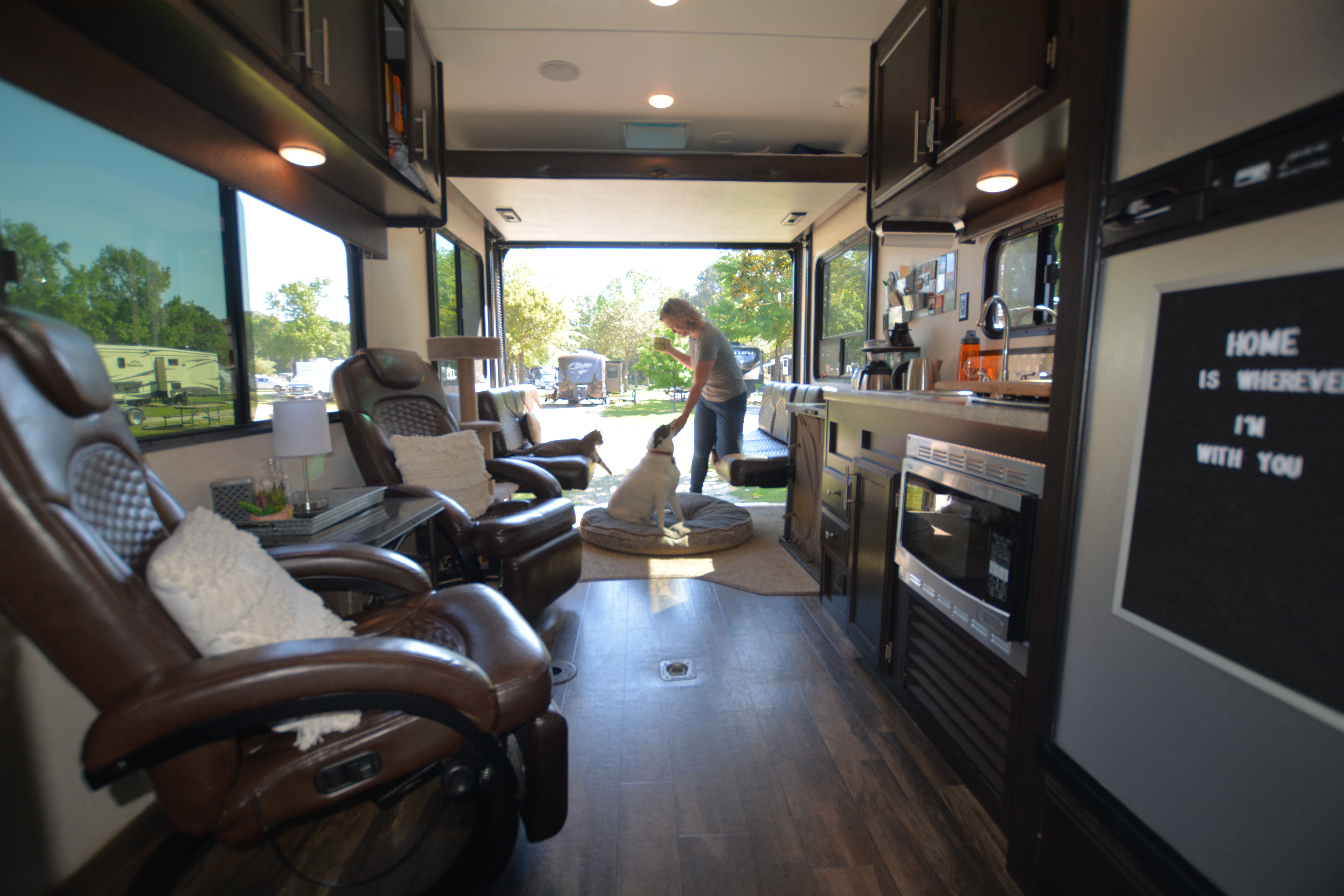 A long shot down the corridor of a Toy Hauler RV, showing off the living room. 