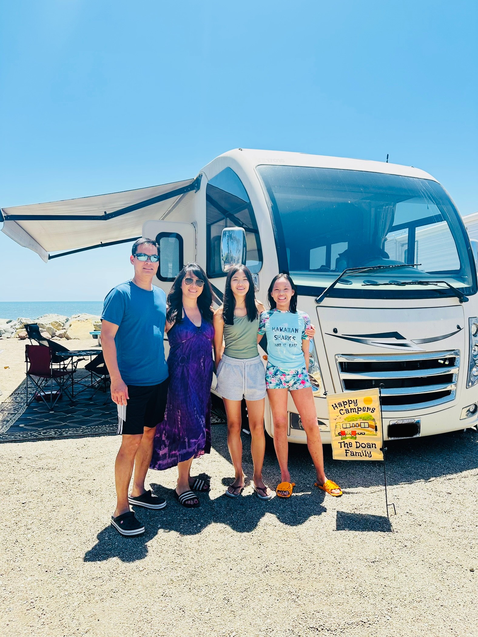 The Brenda Huynh and Tiger Doan family in front of their Thor Motor Coach Vegas Class A motorhome