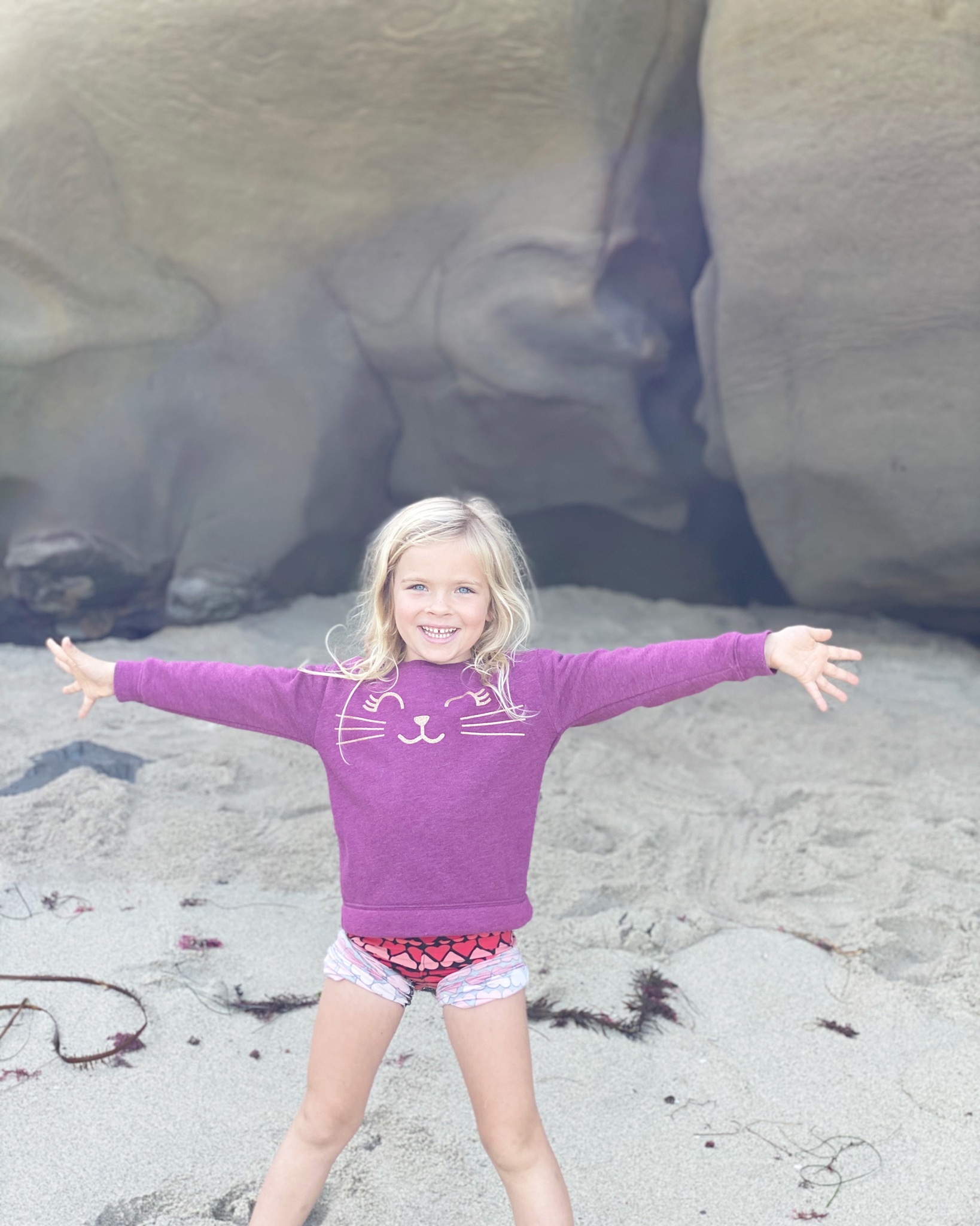A young girl playing outside during the day.