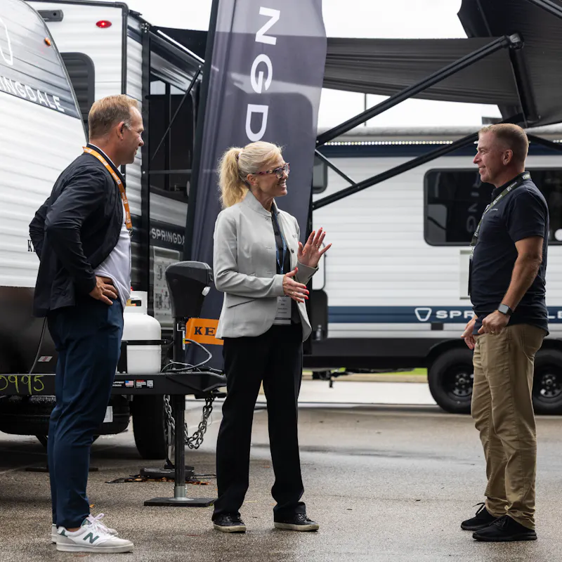An RV representative talking to RV dealers