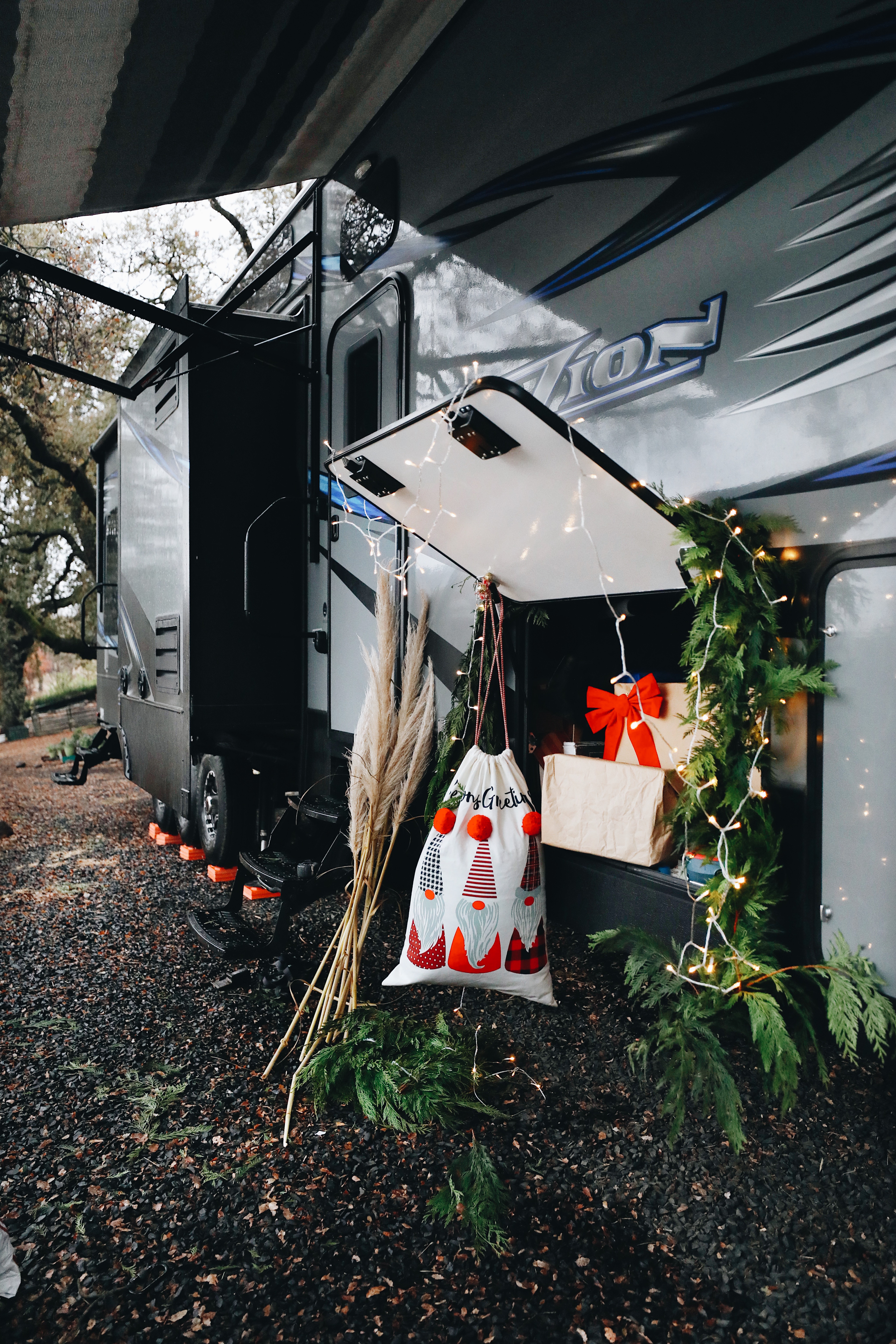 Gifts and decorations piled around the outside storage door on an RV. 