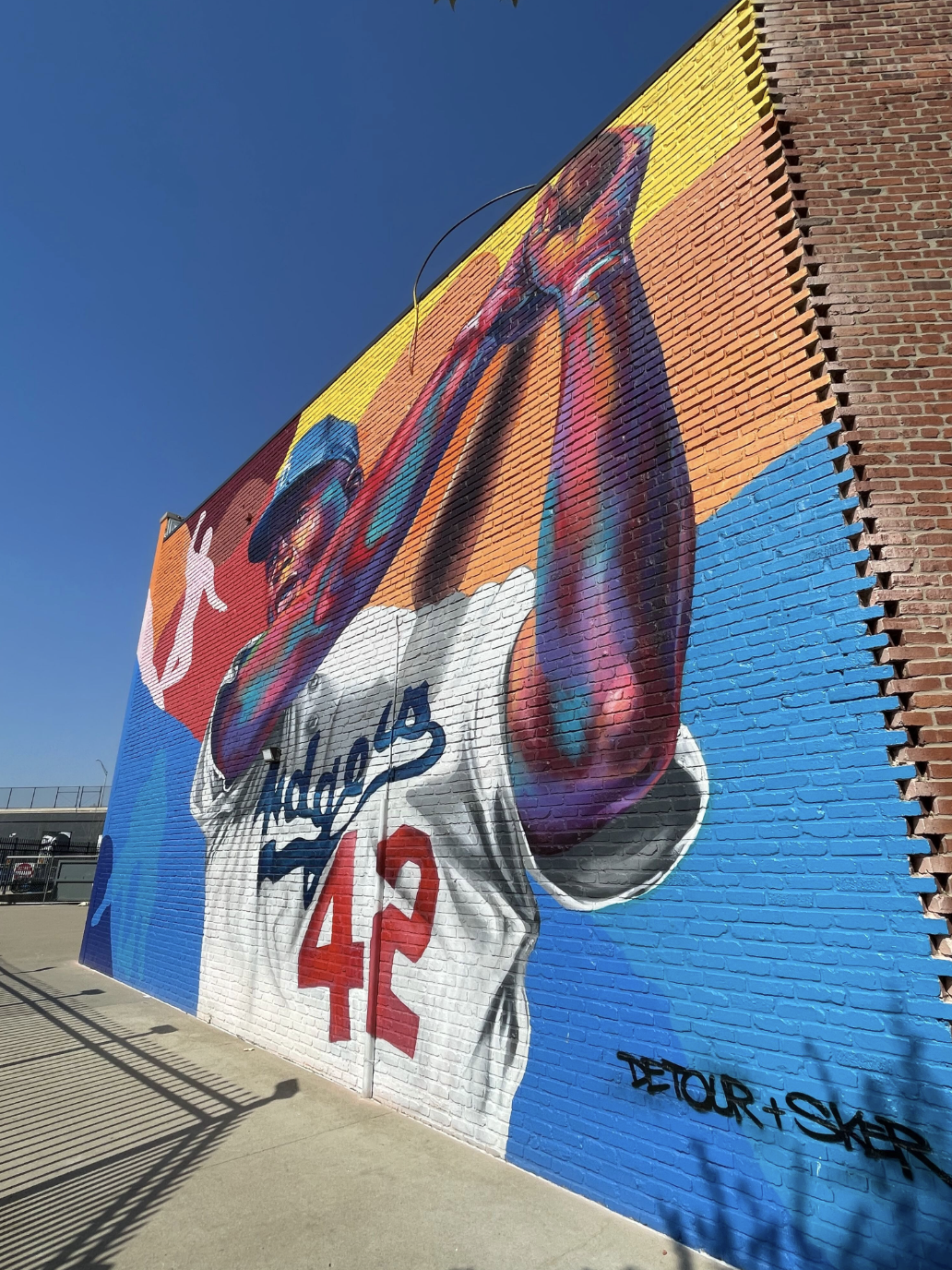 Mural art of a baseball player at Black Wall Street in Tulsa, Oklahoma, captured by Ben and Christina McMillan.