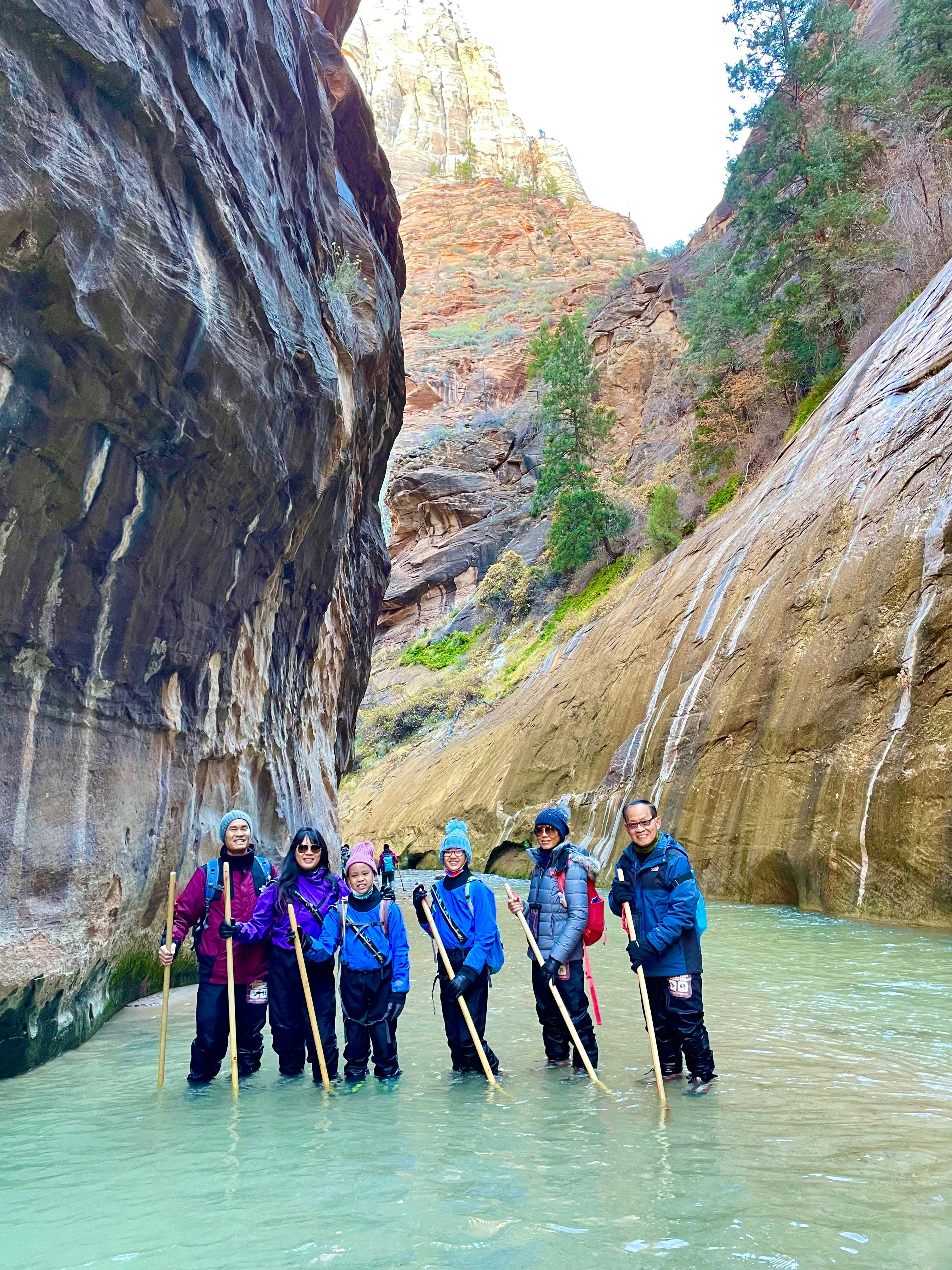 BRENDA & TIGER's group RV trip gathered for a photo on a hike through the Narrows in Zion national park