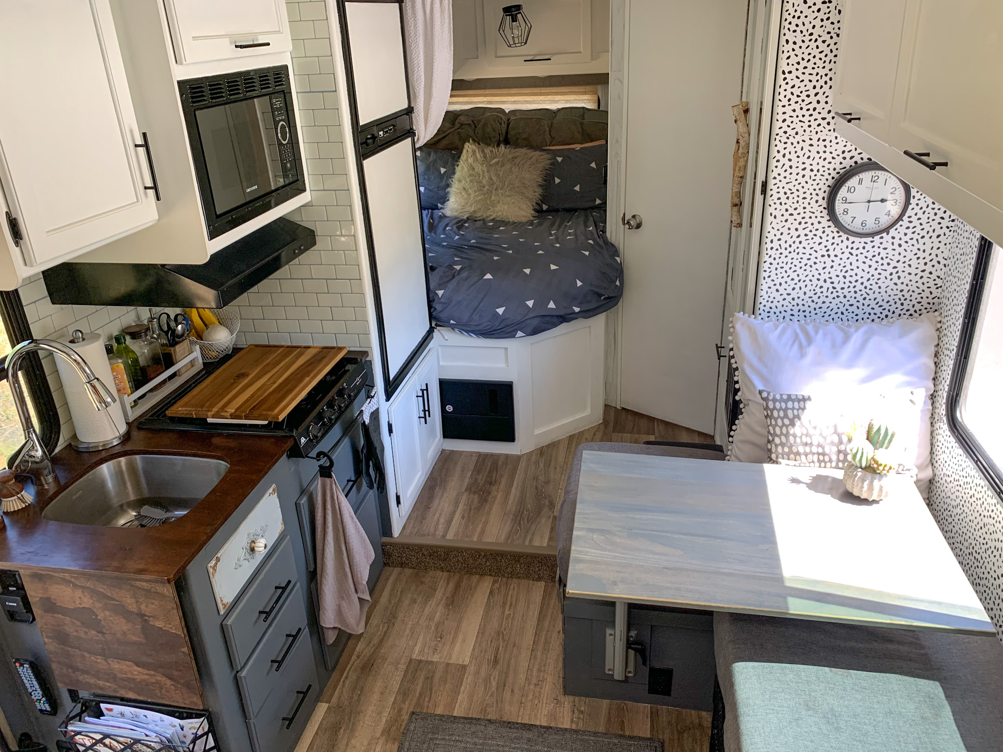 A view of the kitchen, dinette and back bedroom in Jason and Dawn's Class C RV. 