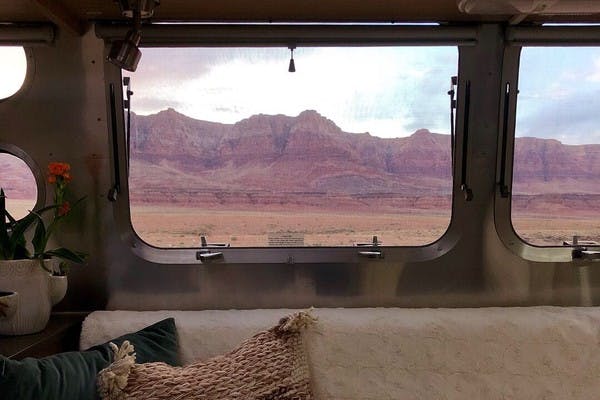 A view from the inside of an RV looking out the window to the Vermillion Cliffs of Arizona.