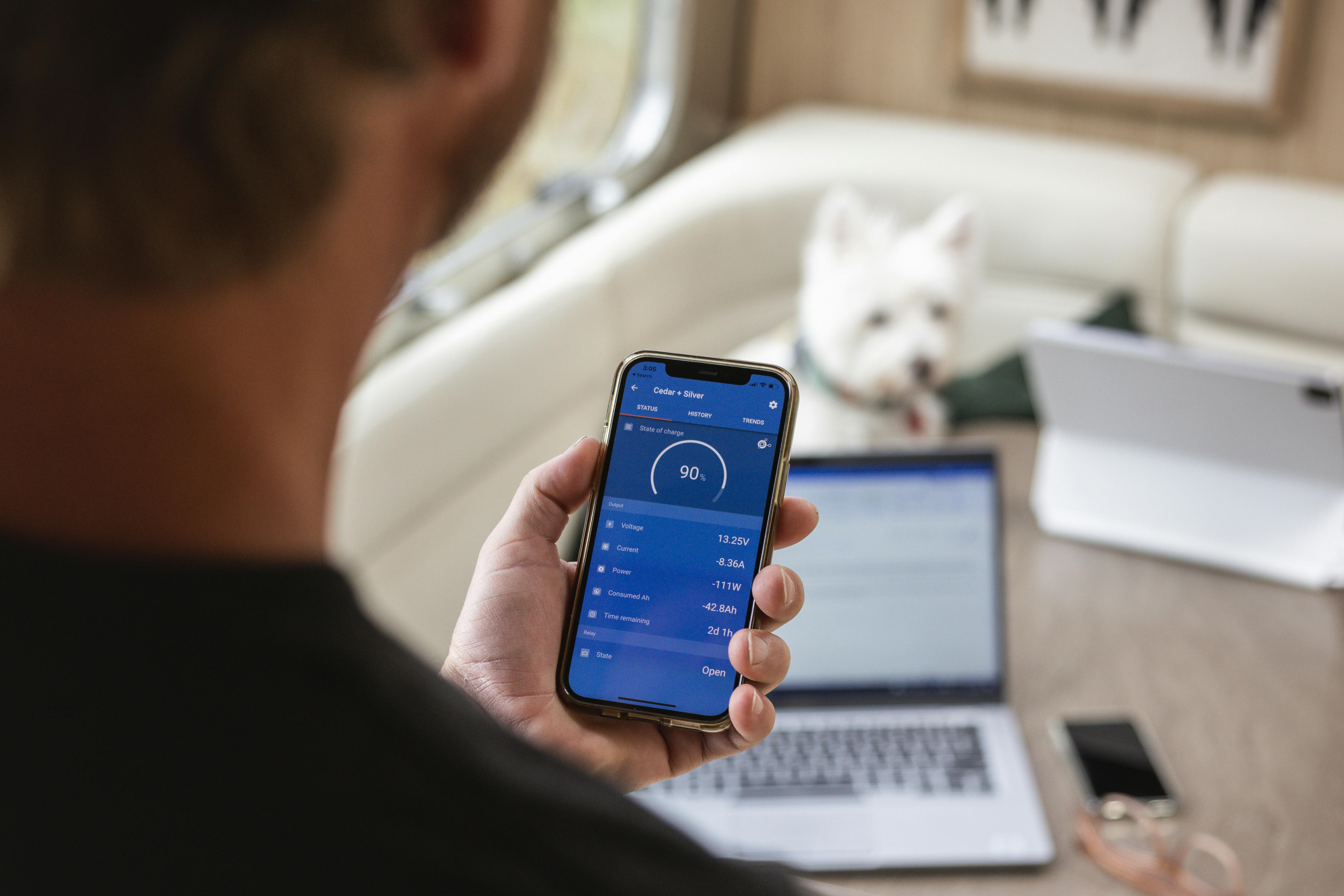 Lenny Blue checking solar levels on his iphone