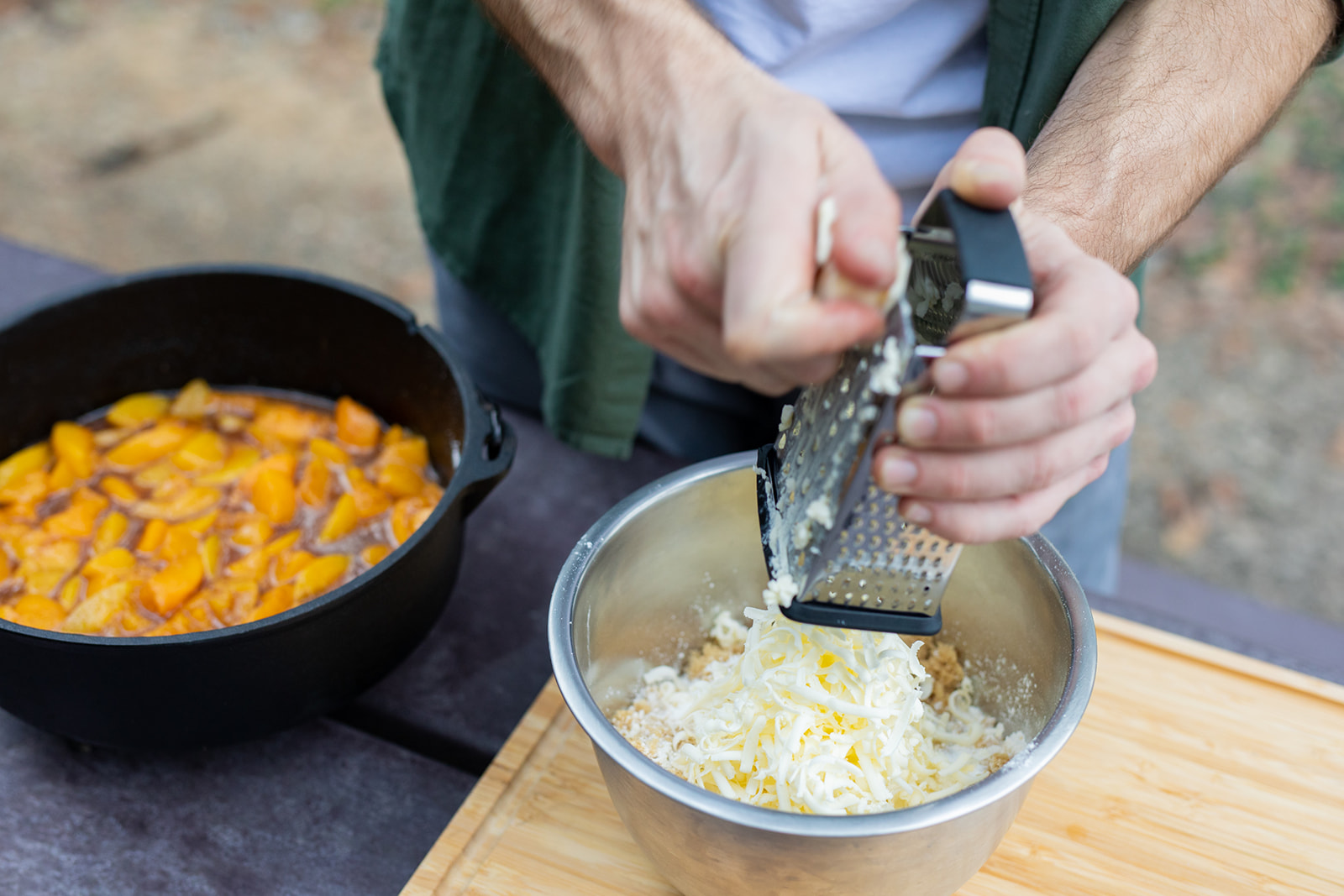 Grating cold butter into a bowl for the cobbler topping. 
