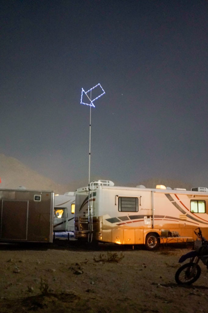 An RV parked at night.