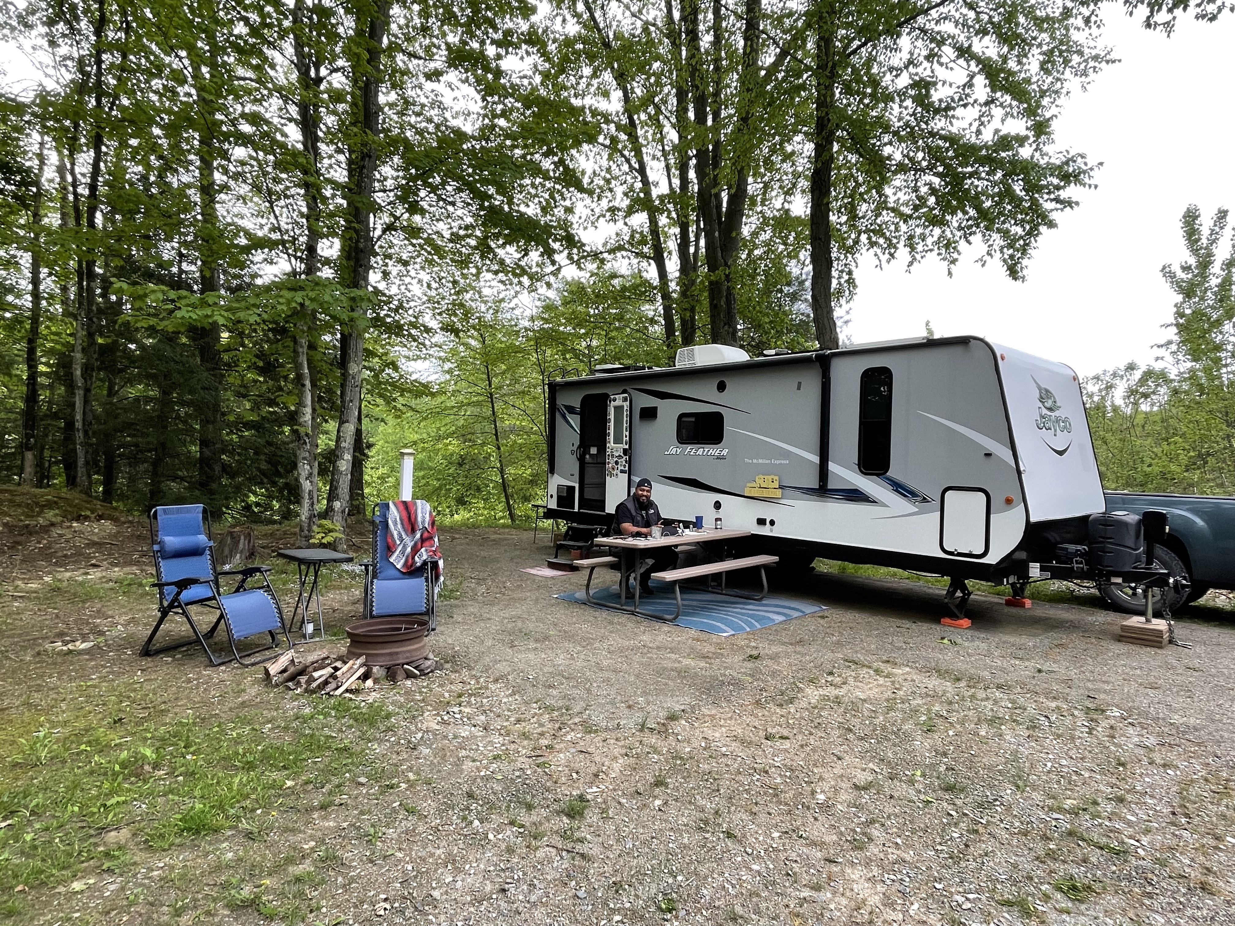 Ben McMillan sitting at a picnic table at their workcamping site