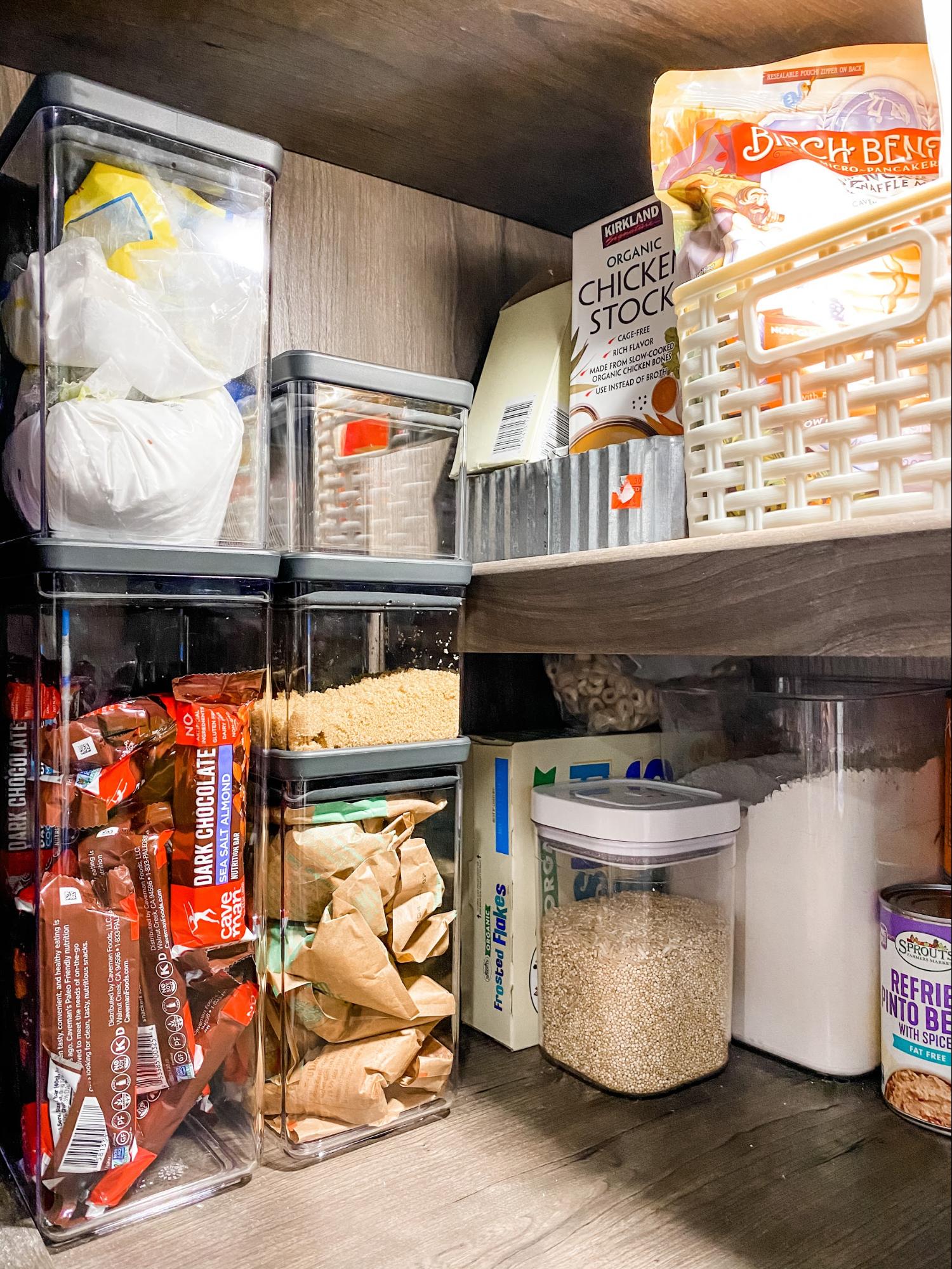Clear canisters in Brittnee Proha's pantry helping to keep snacks and dry goods organized inside her Heartland Cyclone. 