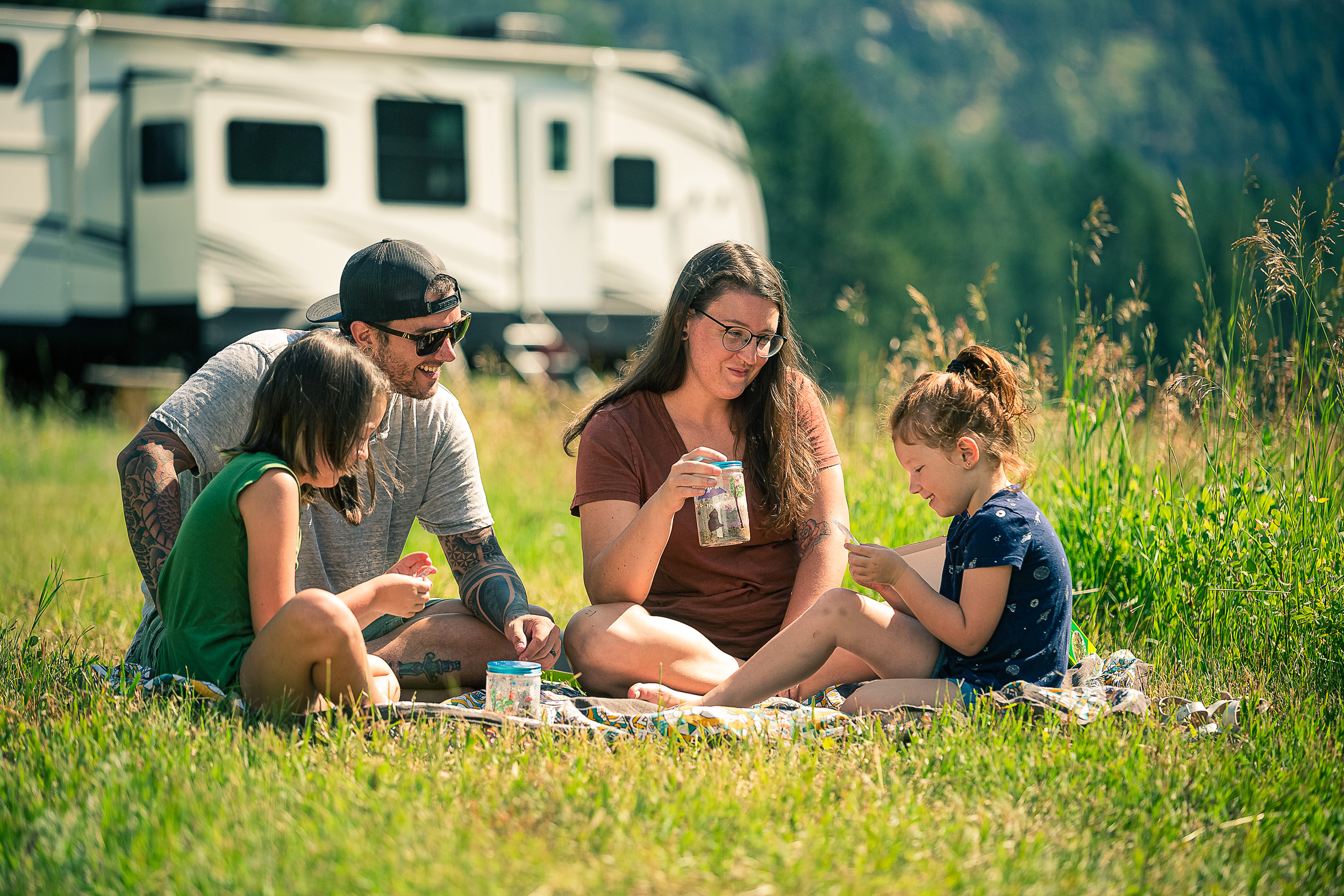 The Roberson family sitting outside learning about science