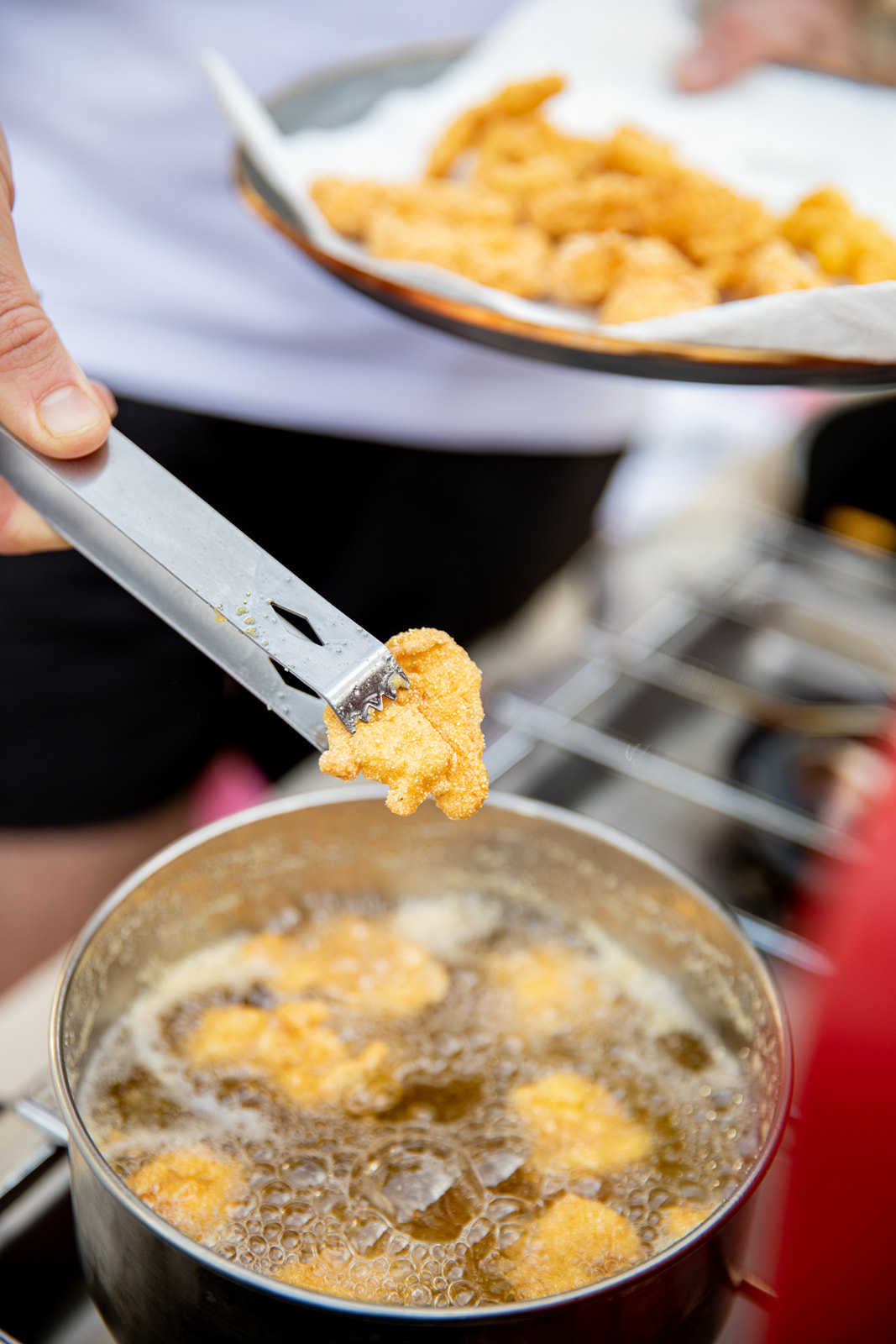 Frying shrimp in hot oil.