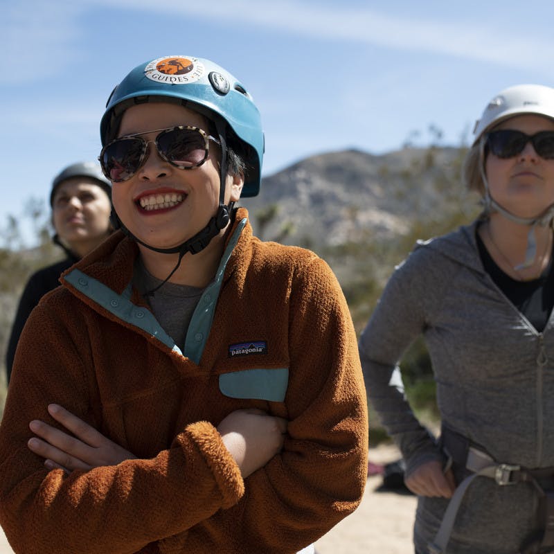 Showcase smiles with excitement with her helmet on her head.