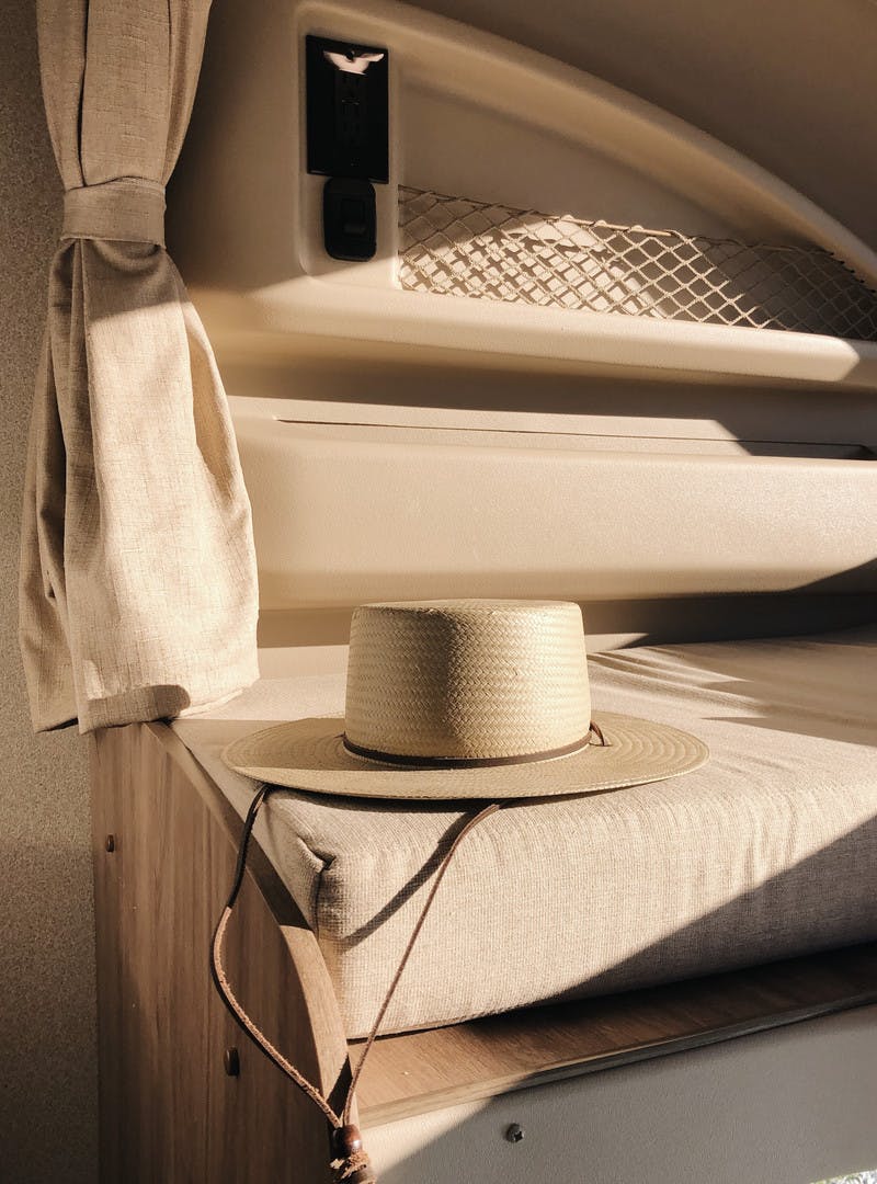 Interior shot of Entegra Class C RV with a hat on the seat.