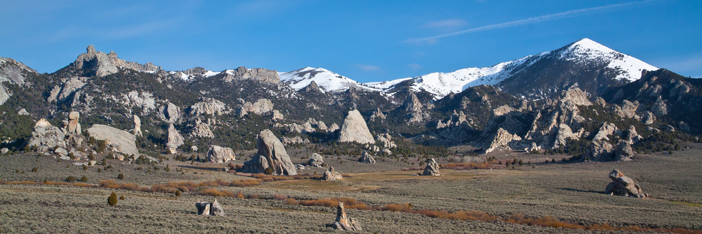 The rocky base of snowcapped mountains.