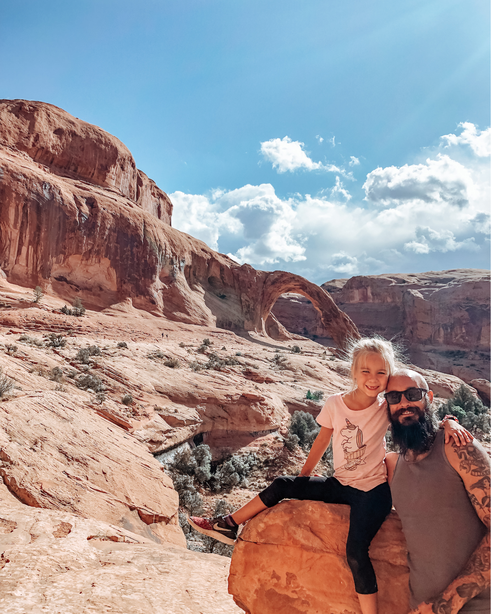 Justin Russell and his daughter pose for a picture on a hike. 
