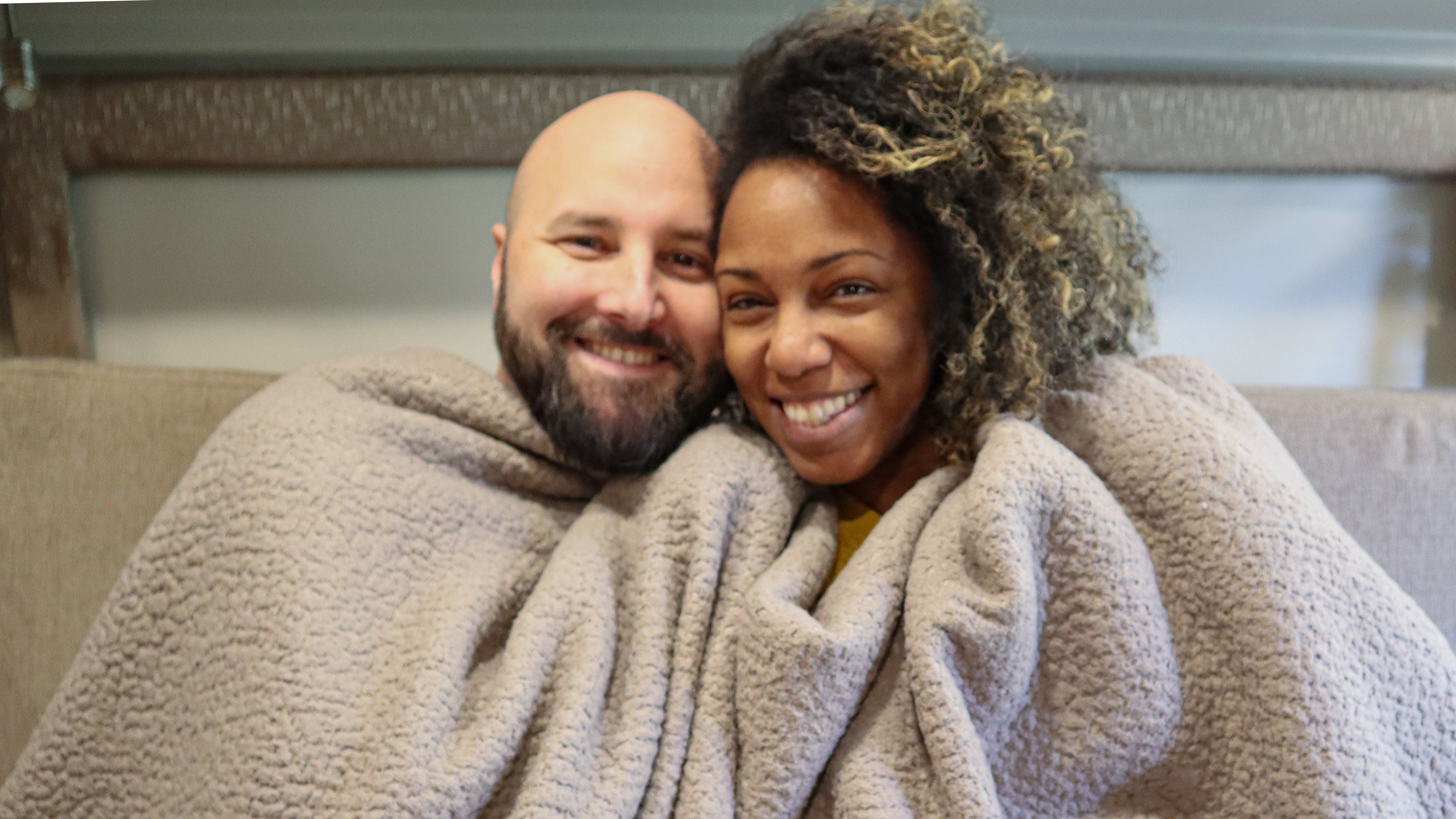 Gabe and Rocio bundled in a blanket