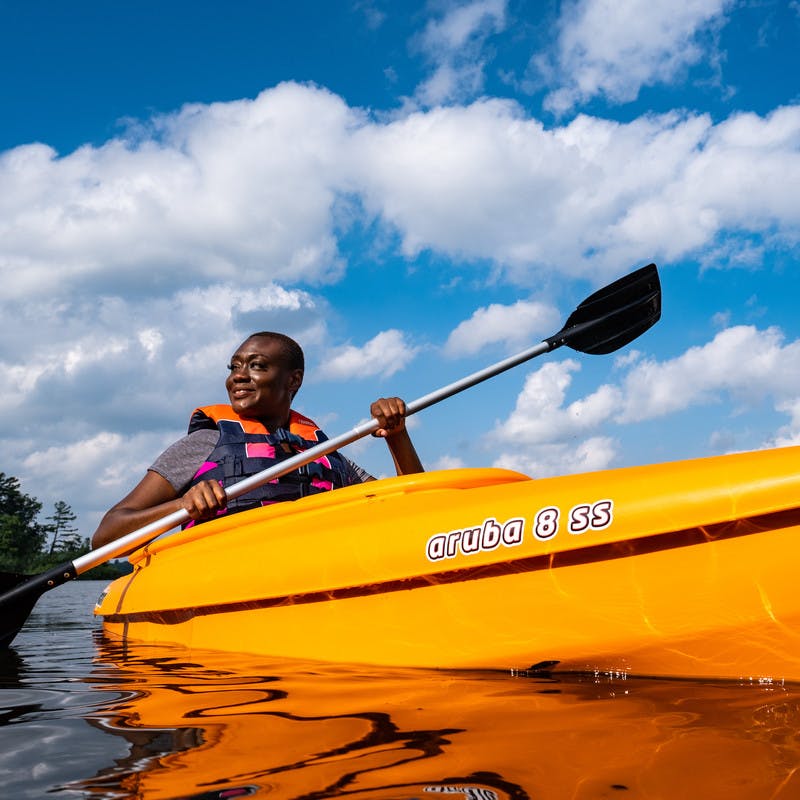 Chanel Tate kayaking in the lake.