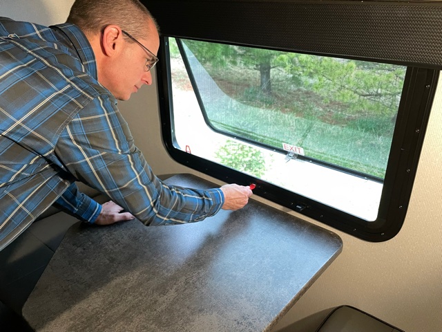 Matt Gleason checking the windows in his RV