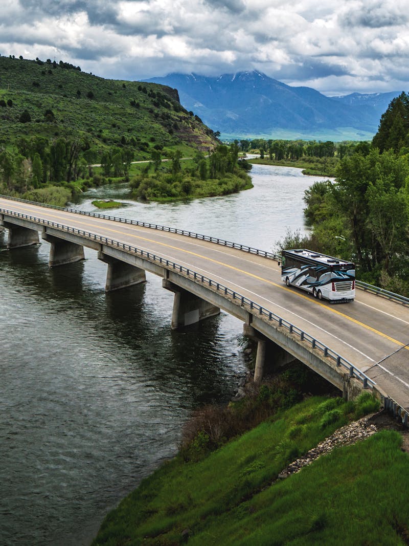 A Tiffin Class A Motorhome driving across a bridge