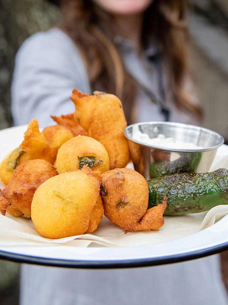 A plate of freshly fried jalapeño hush puppies.