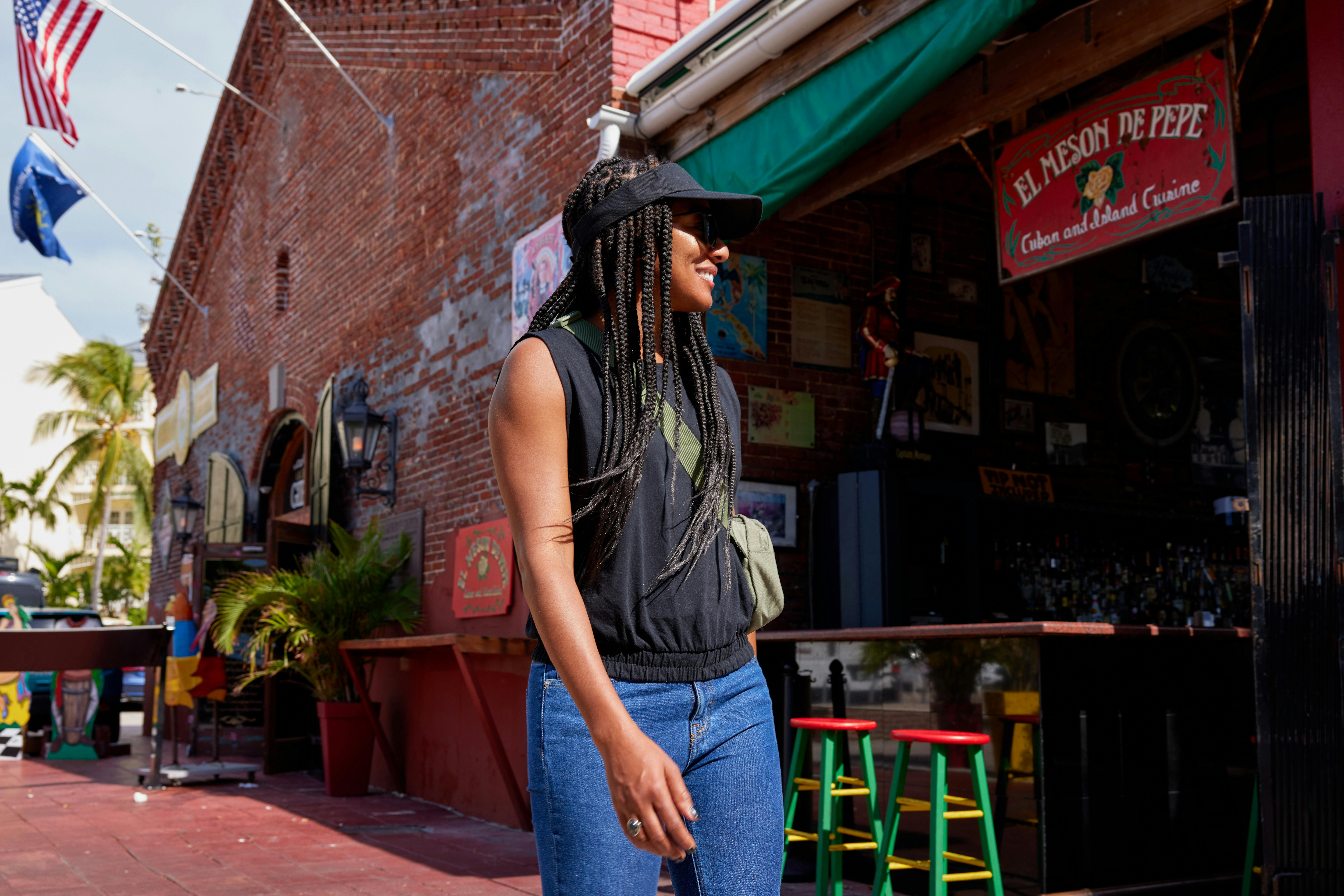 Travel writer Adrienne Jordan walking by El Meson de Pepe in Key West, Florida.