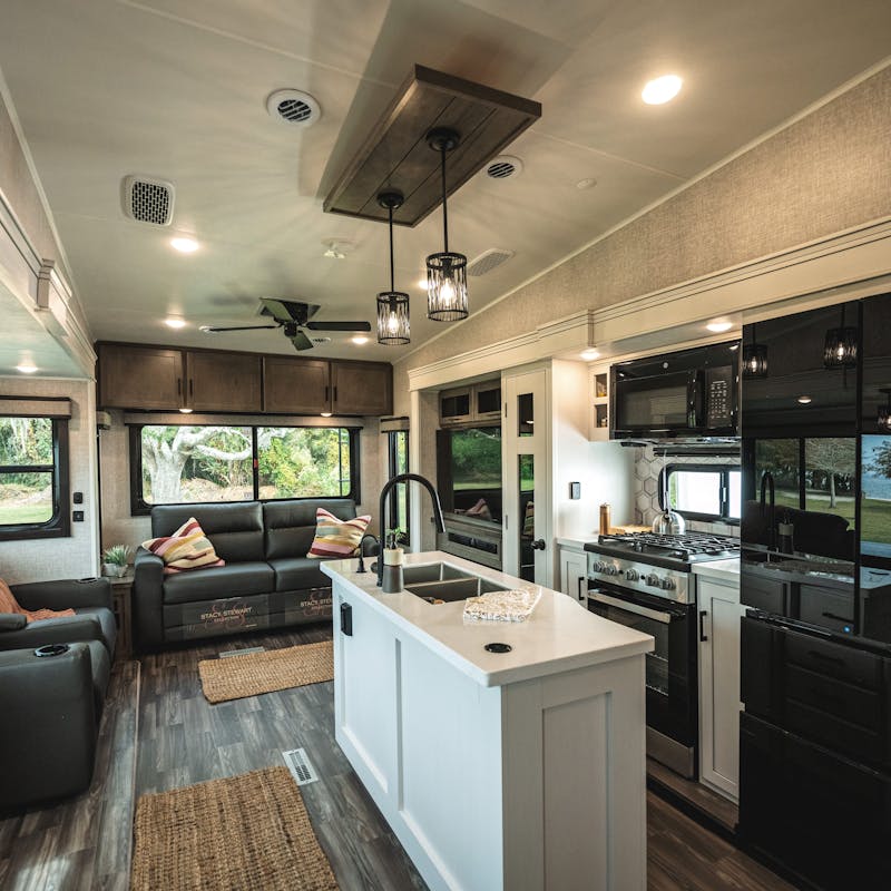 The interior of a Jayco Eagle featuring a kitchen and a living room.