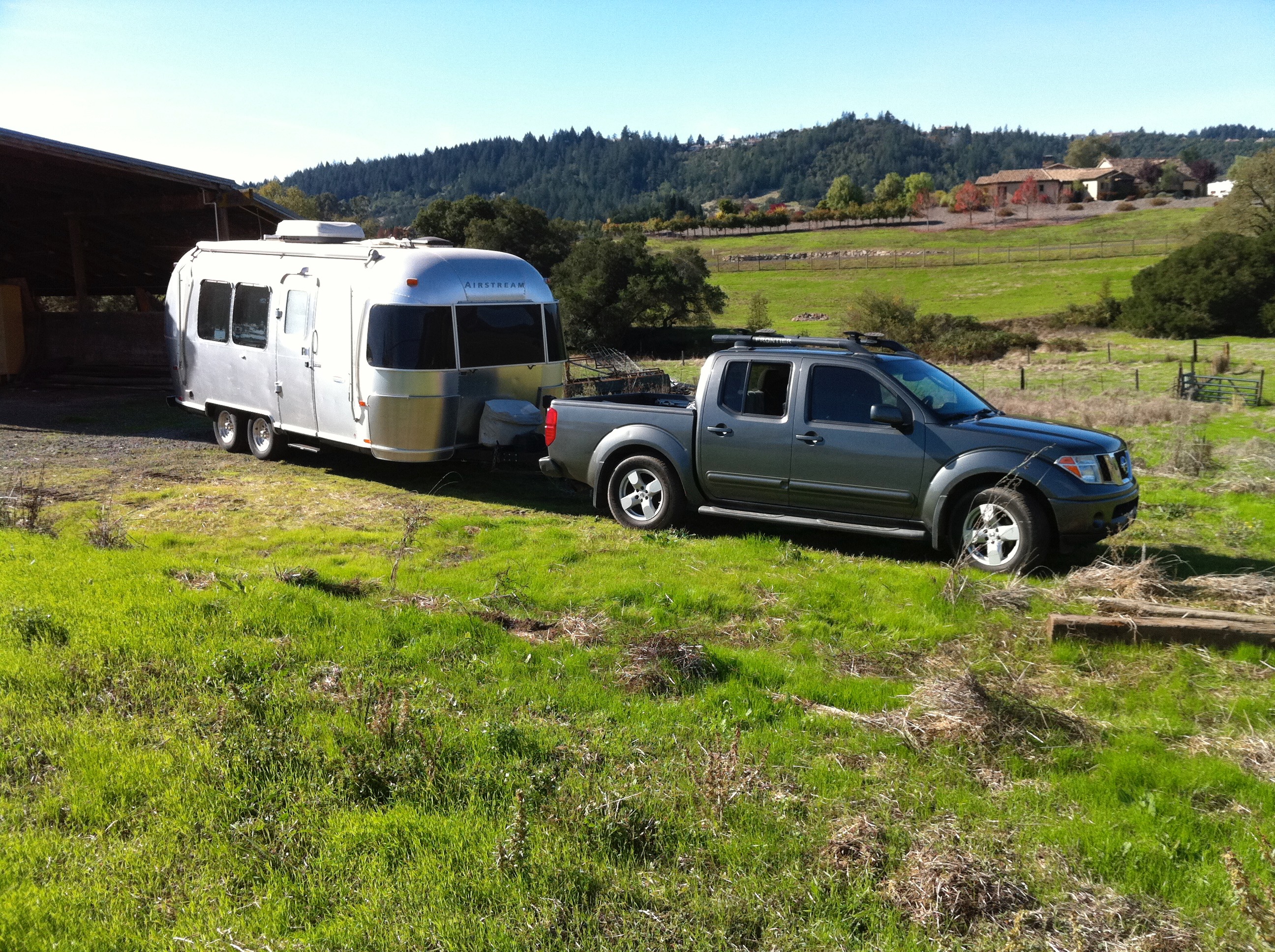 A truck pulling an Airstream trailer. 