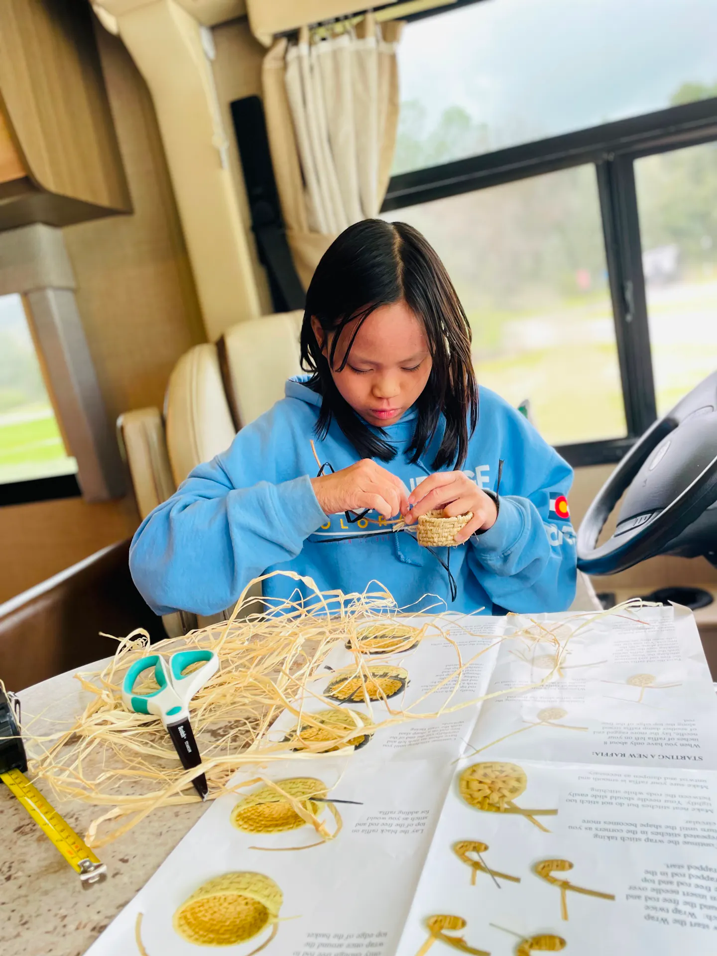 Brenda and Tiger's daughter weaving a basket 