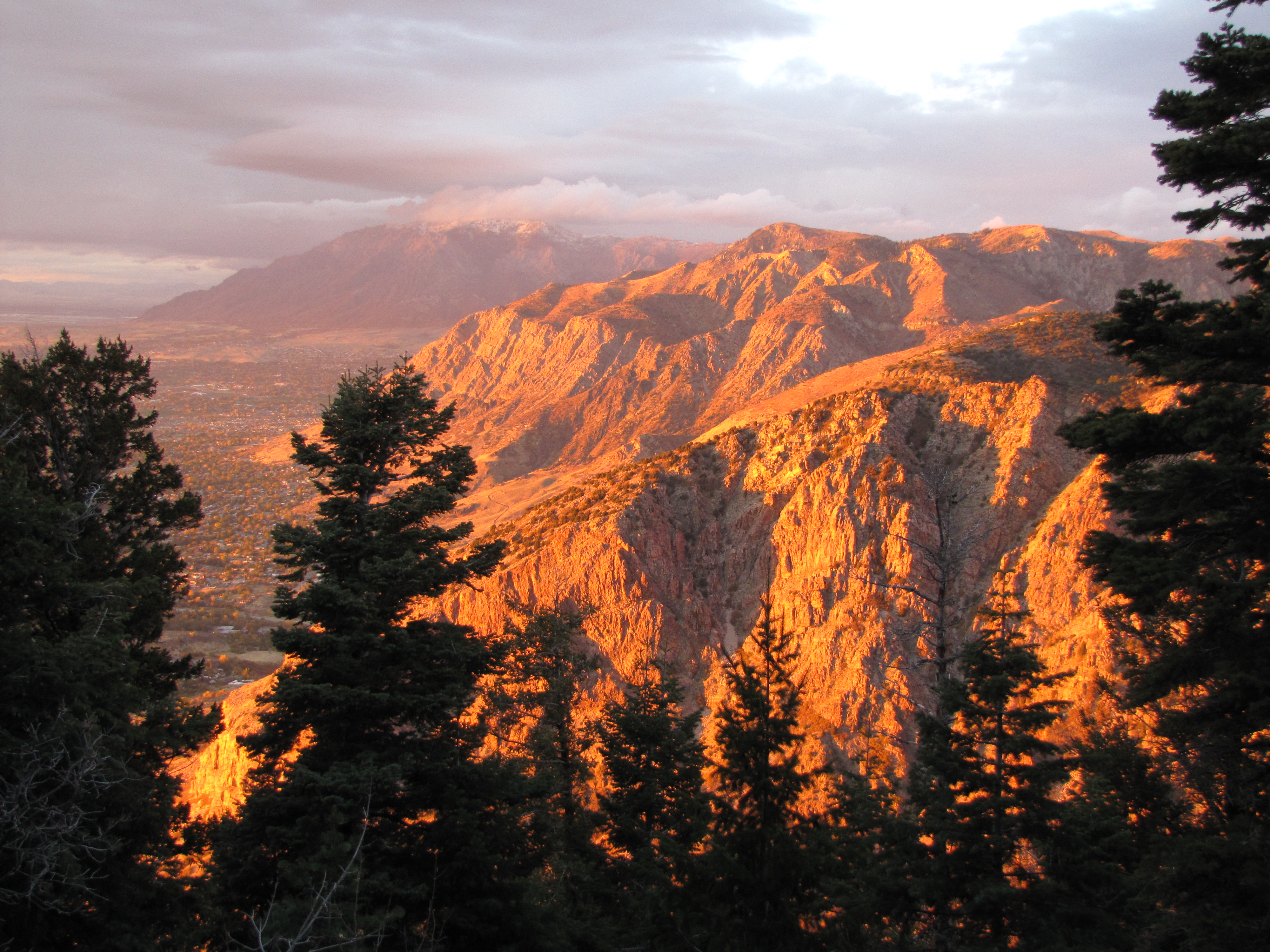 A sunset pouring over a mountainside in Uinta-Wasatch-Cache National Forest. 