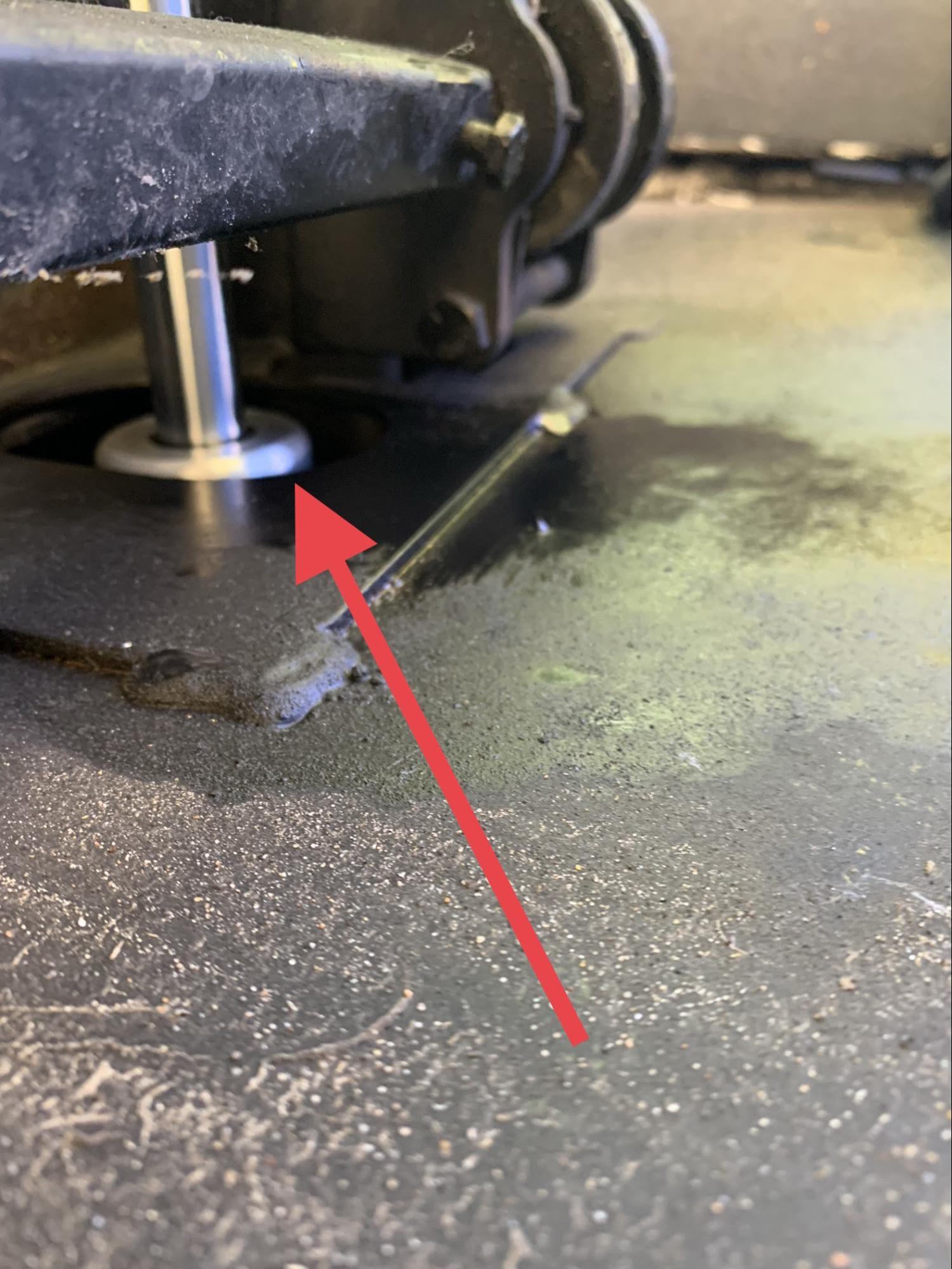 Tom Boswell showing where a hydraulic cylinder was leaking. 