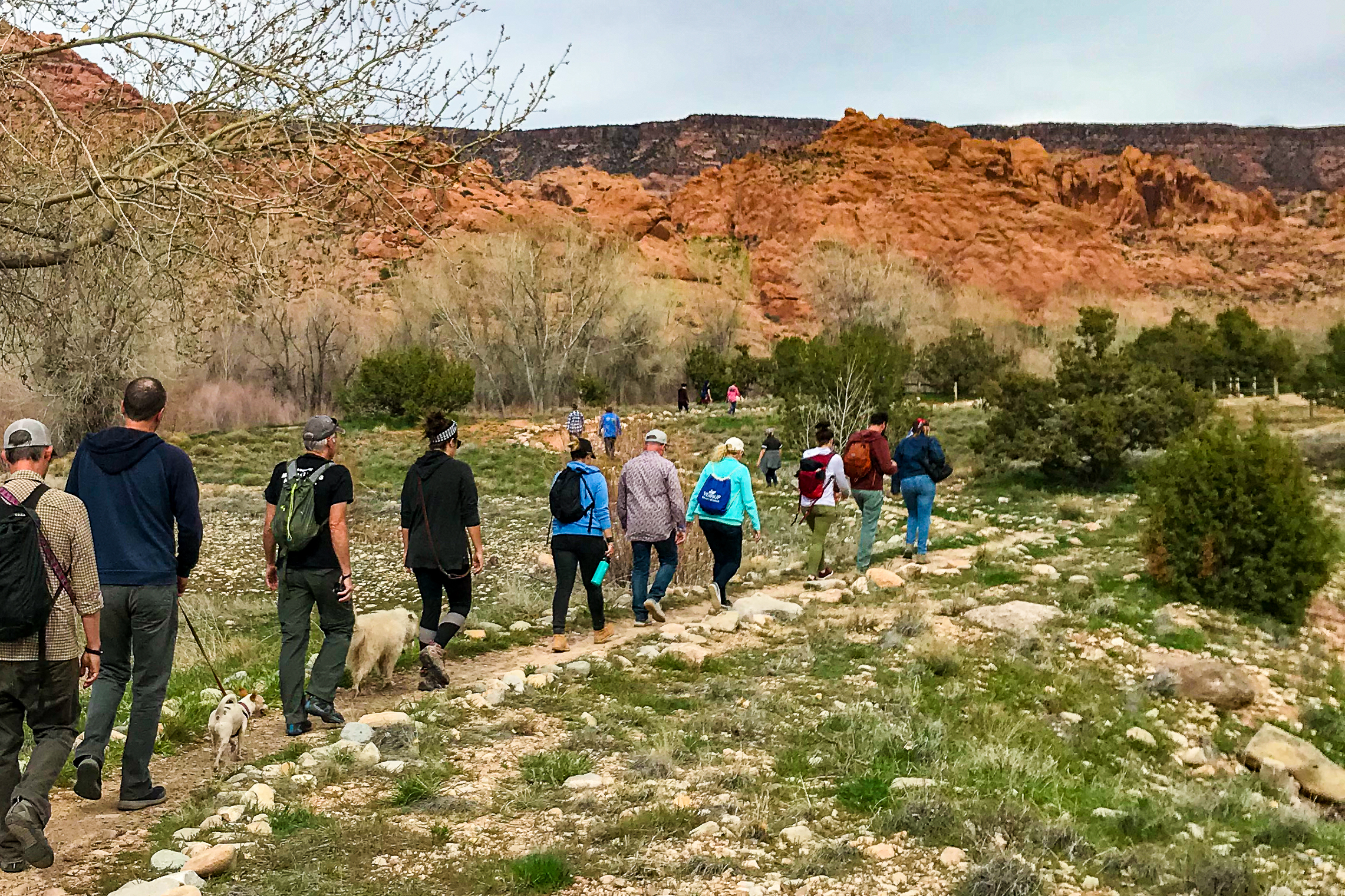 Greg Graham and a group of hikers going down a path.