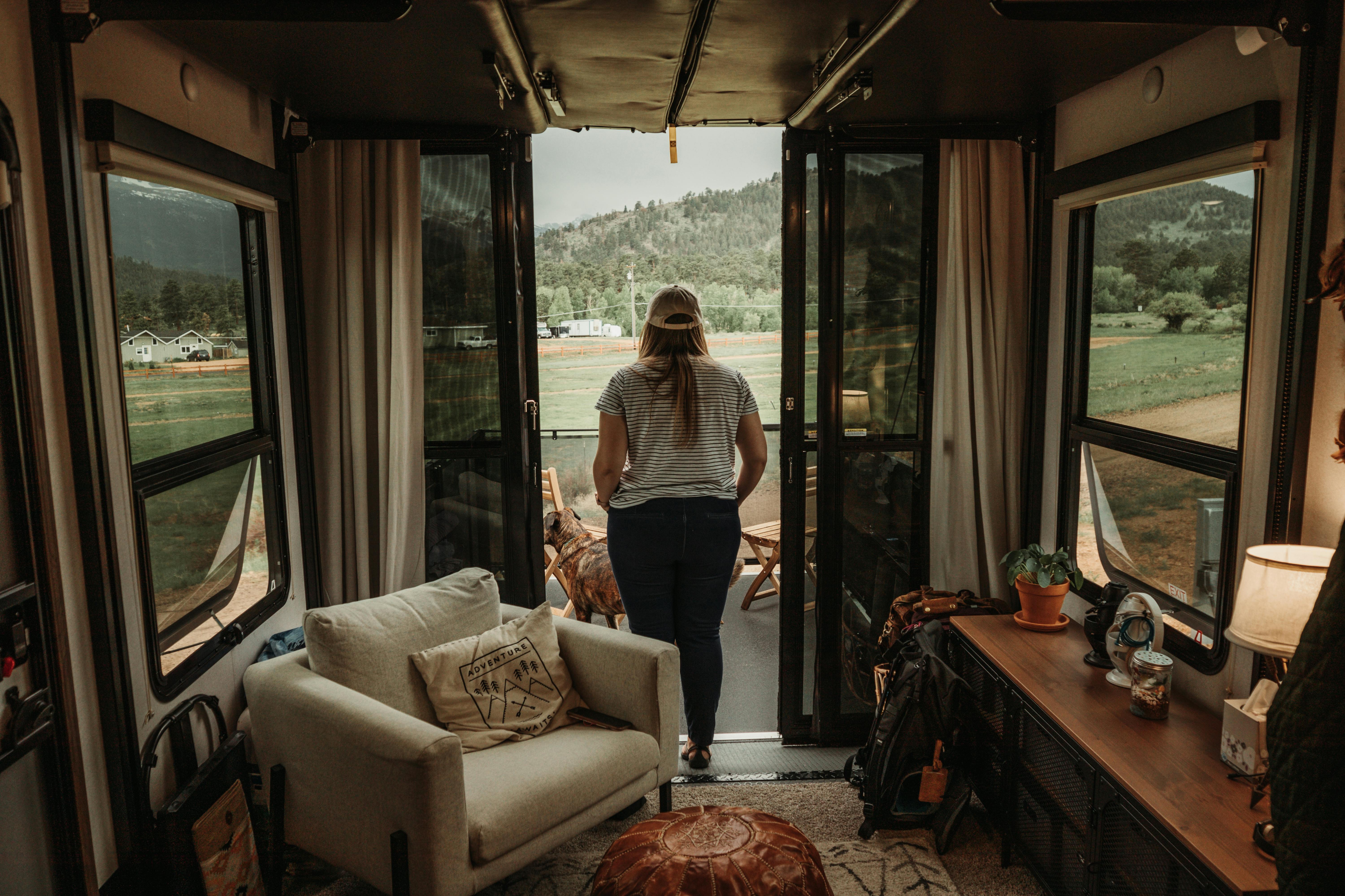 Kristen Murphy looking out at her campsite through the garage in her toy hauler RV