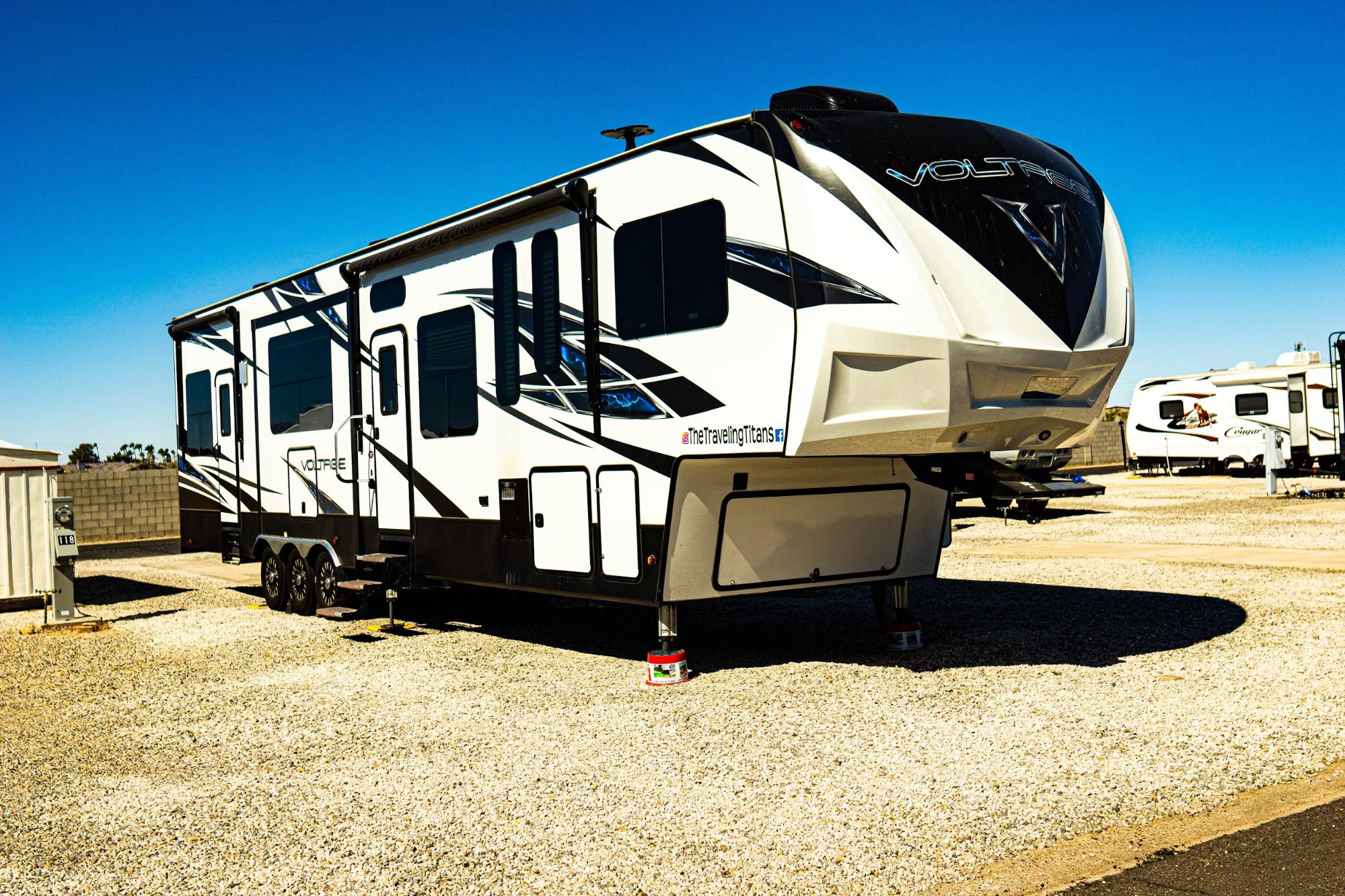 Samantha and Blake's Dutchmen Voltage parked in a gravel lot. 