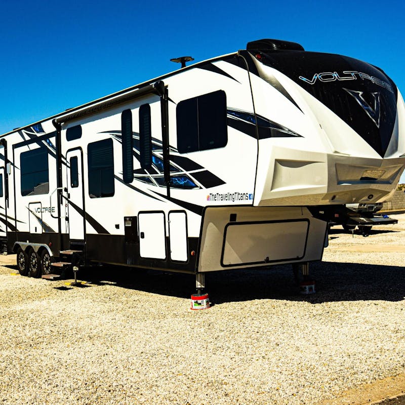 Samantha and Blake's Dutchmen Voltage parked in a gravel lot.