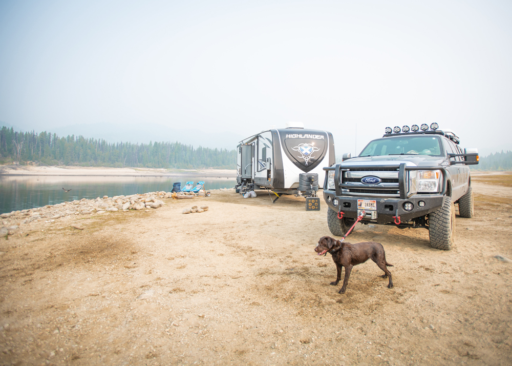Nate Day's dog on a leash next to an RV and truck.