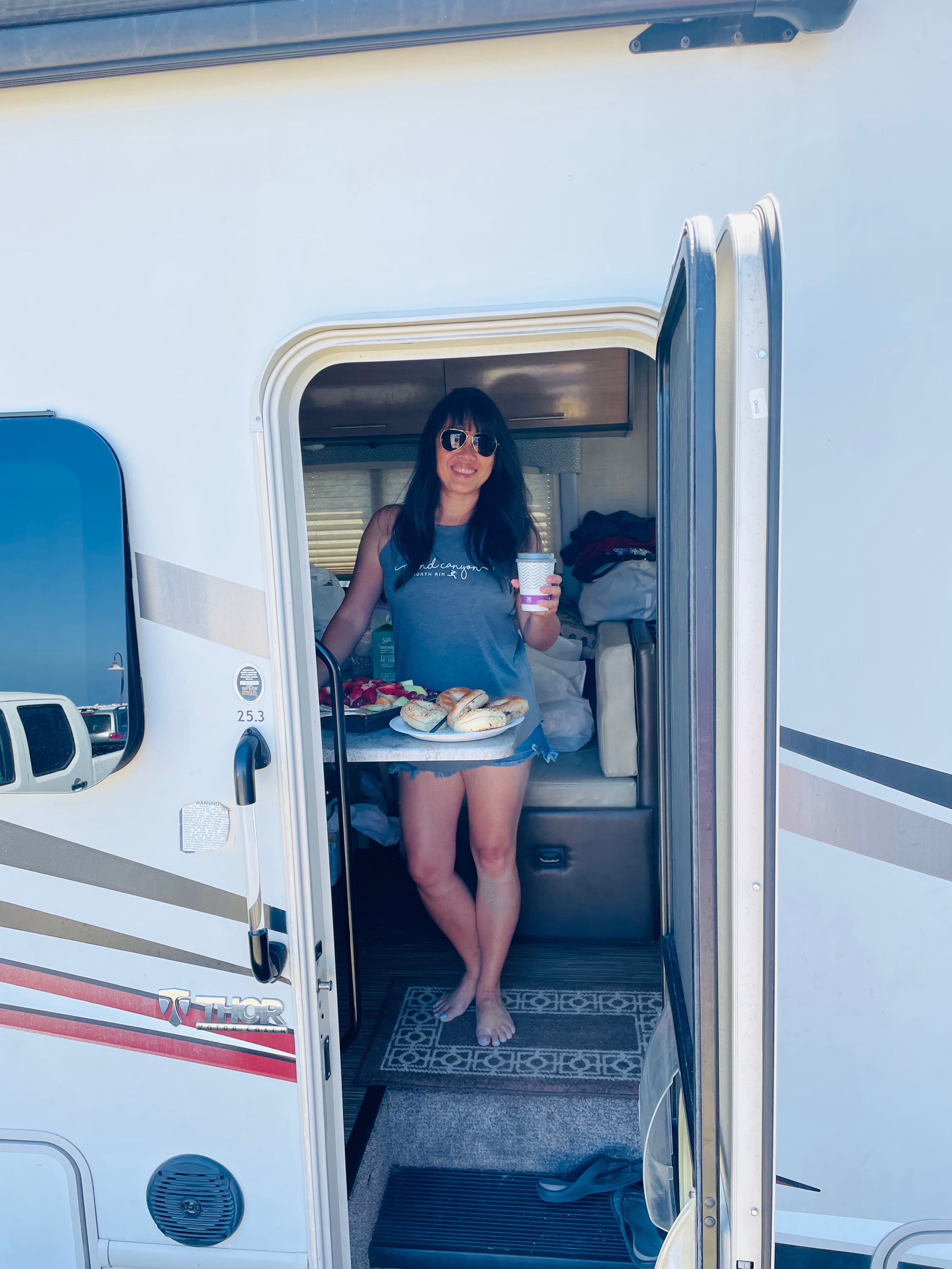 Brenda Huynh inside her Thor Motor Coach Vegas Class A motorhome with breakfast