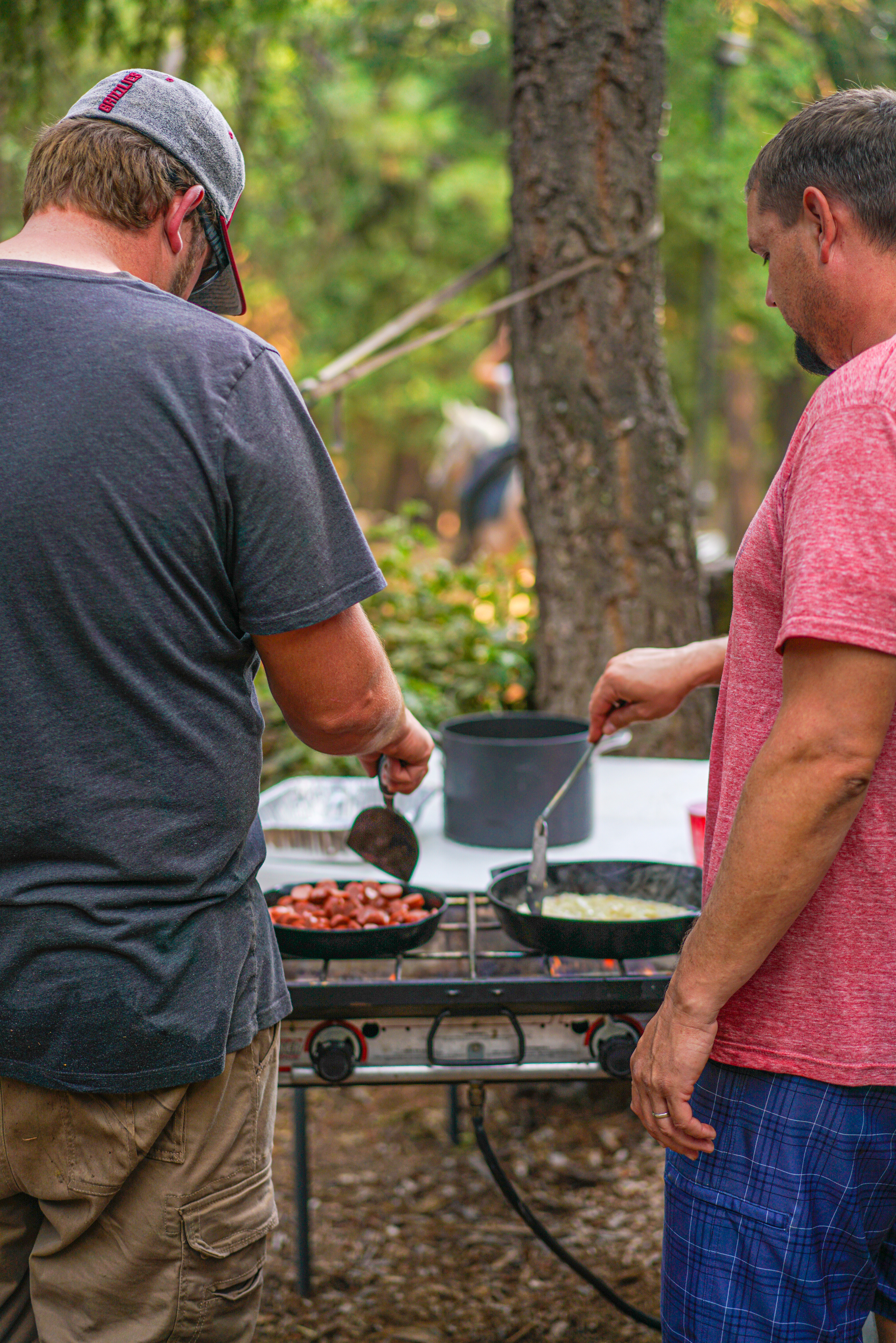 Renee Tilby's husband and a friend cooking on a table top grill