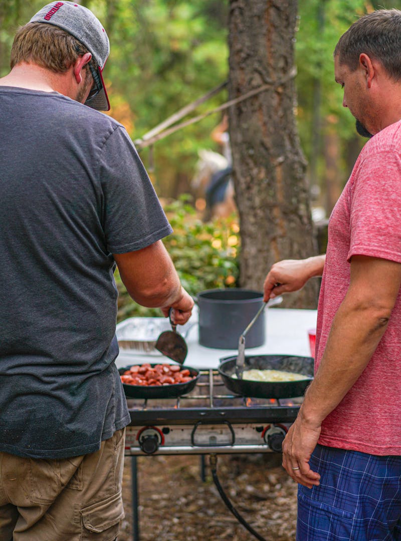 Renee Tilby's husband and a friend cooking on a table top grill