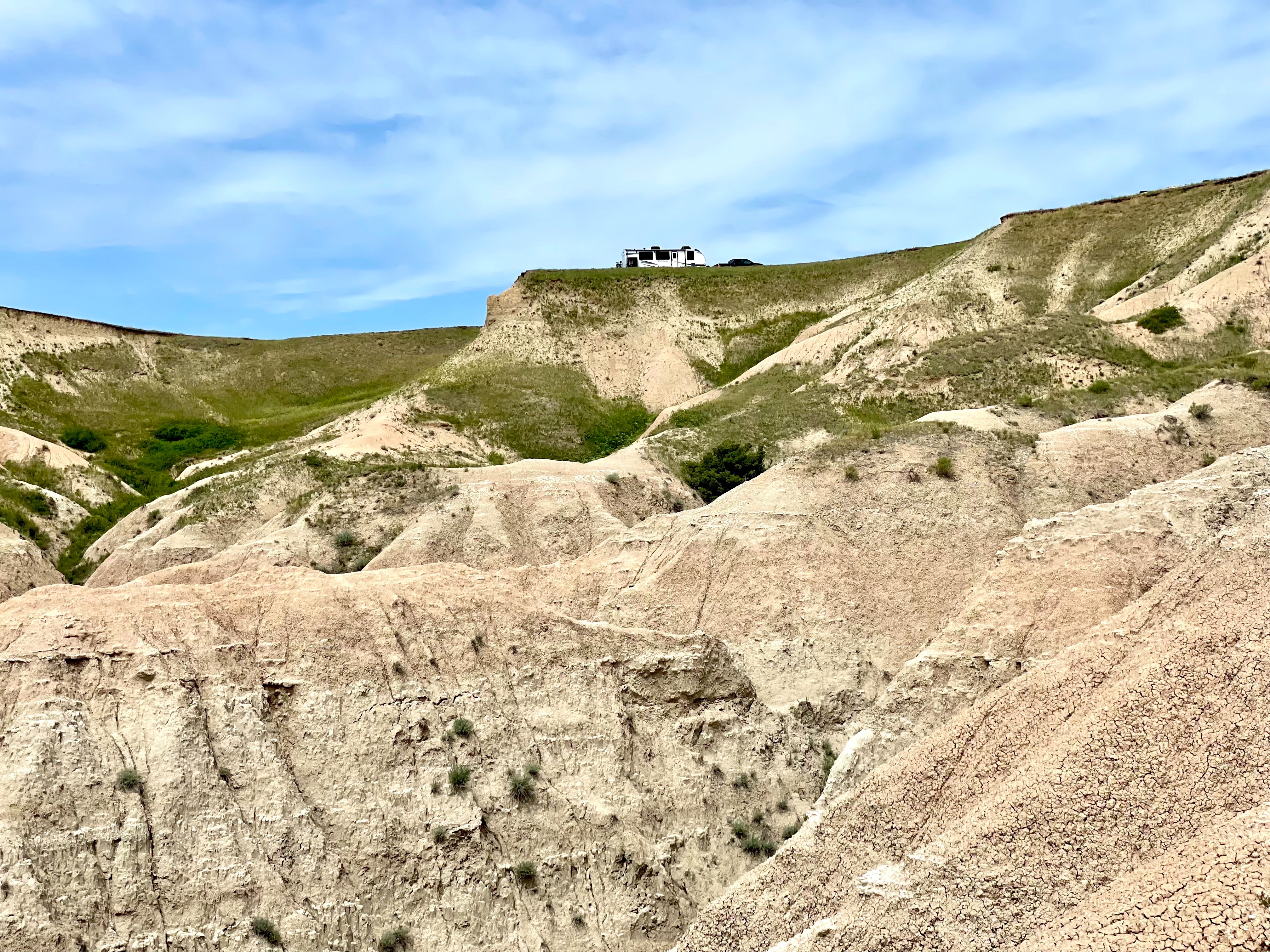GIANCARLO DAMIANI AND ERIK LEAZURE's RV on top of a valley
