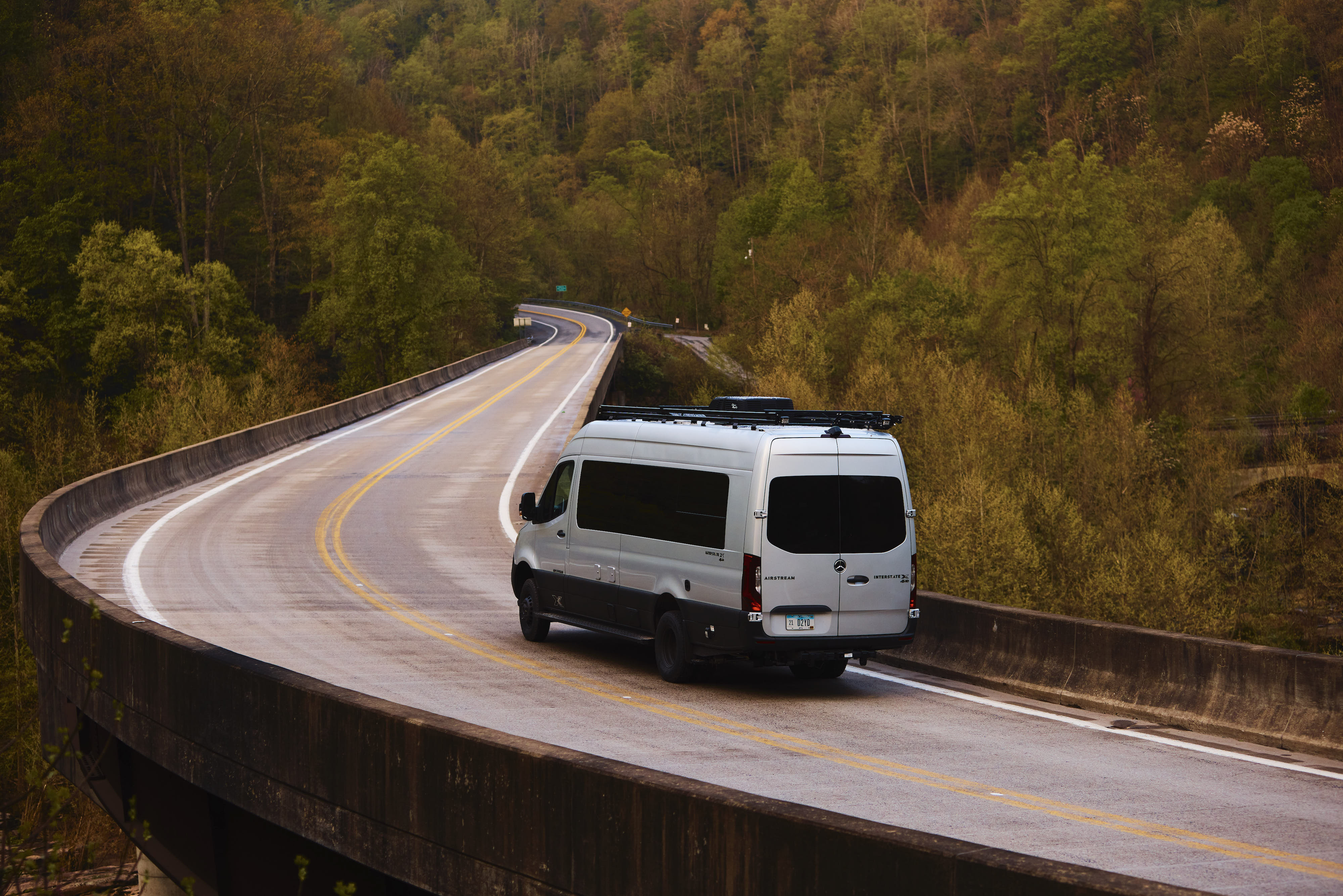 Kathy Karlo driving an Airstream camper van