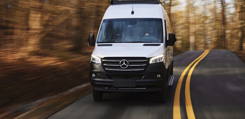 Kathy Karlo driving an Airstream camper van