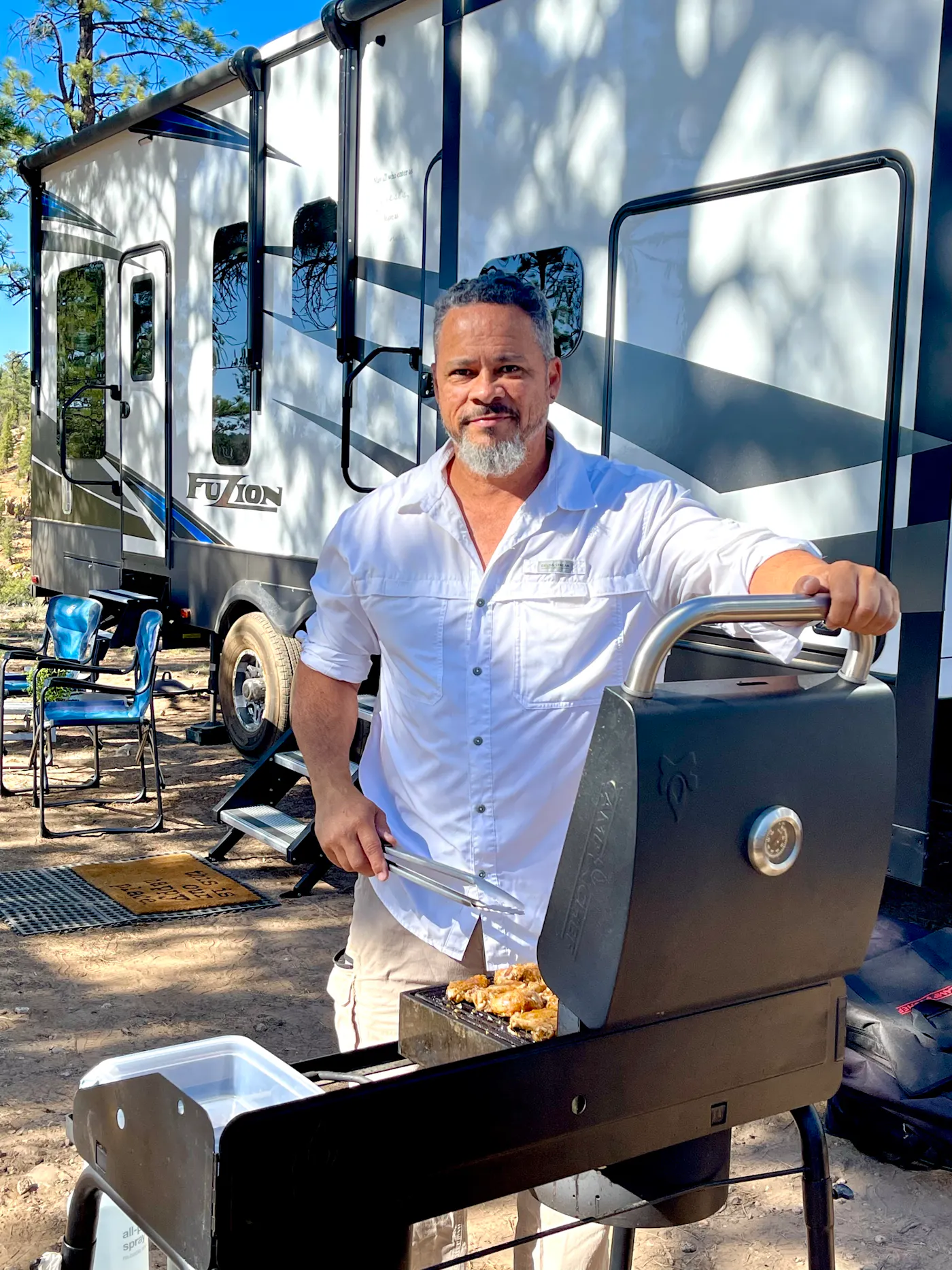 Warren Baxter grilling outside of their Keystone Fuzion