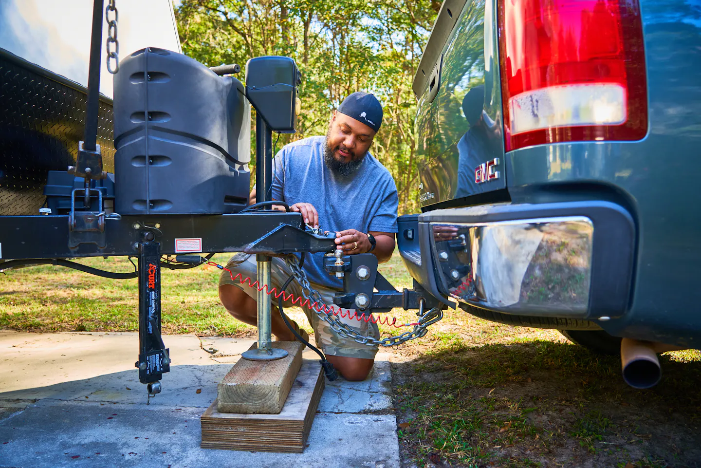 Ben McMillan hitching up his travel trailer and securing safety systems