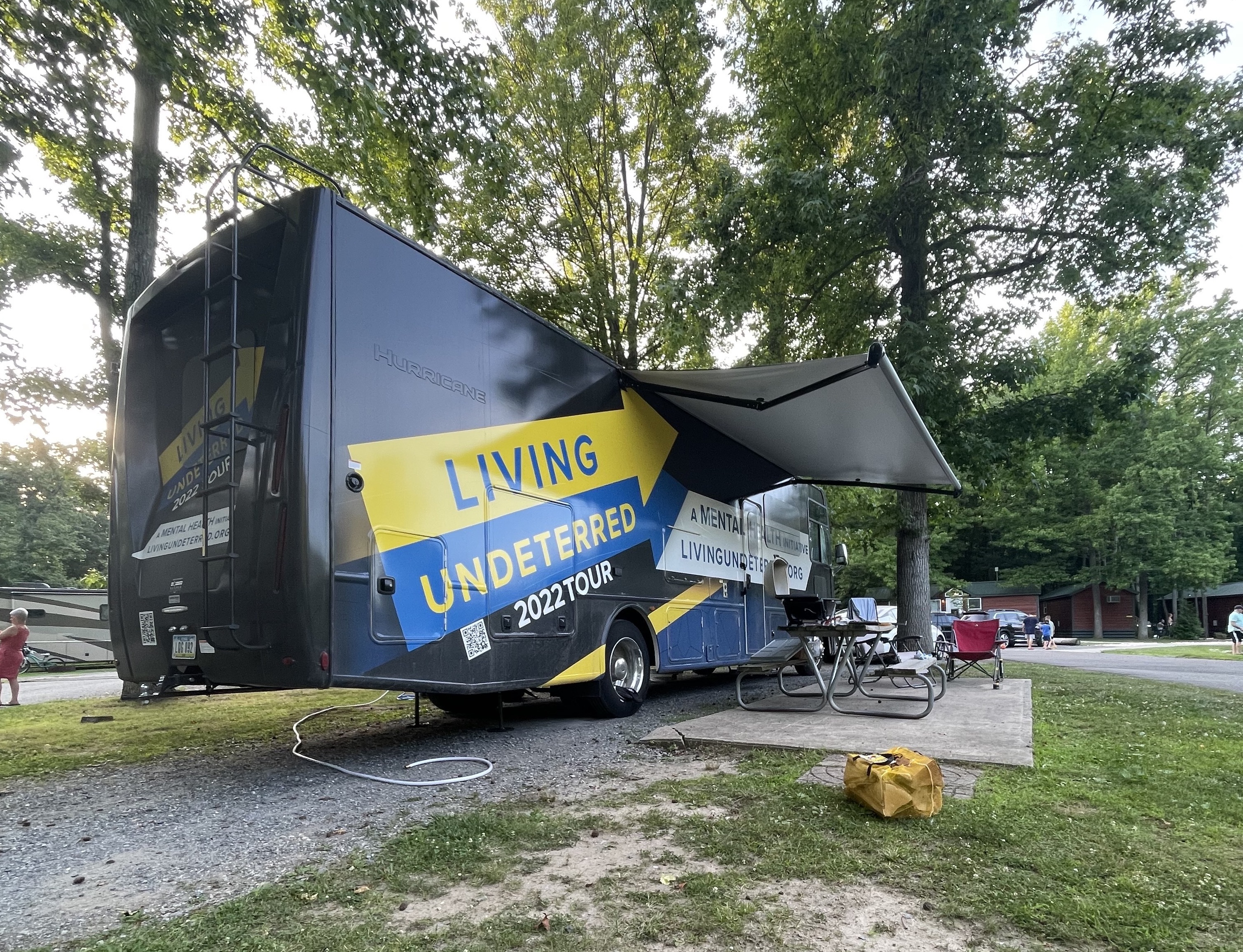 Jeff Johnston's Class A rv parked at a campsite
