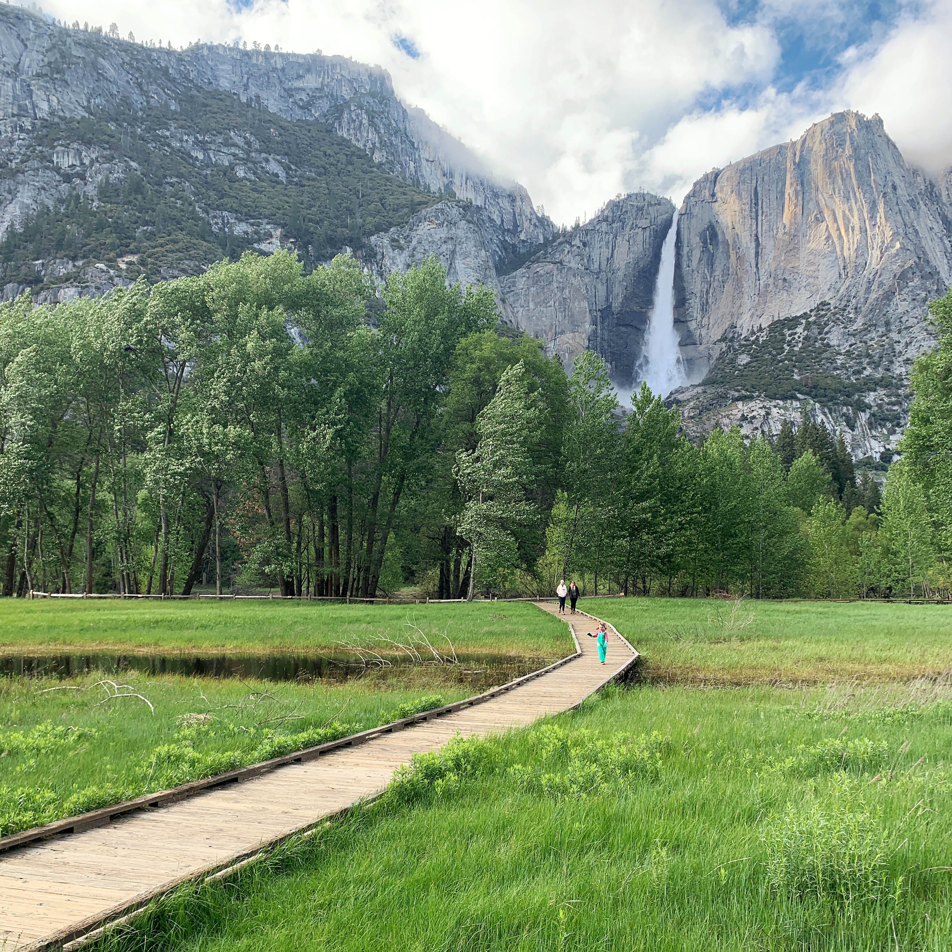 Sarah Hubbart walks down a boardwalk on a hike. 